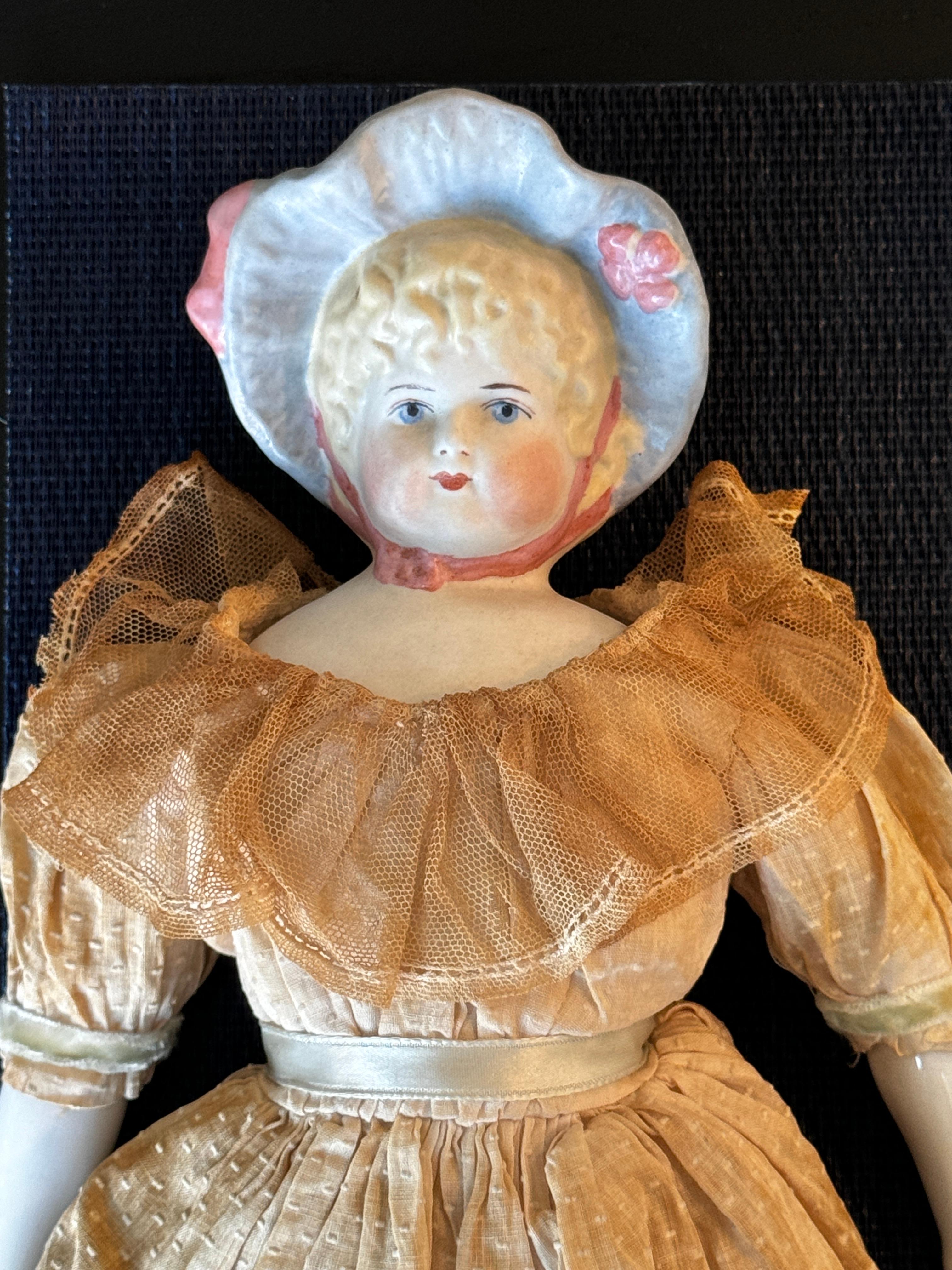 Two 19th Century Bisque + Porcelain Dolls

One signed Lathrop on back of shoulders

5.5