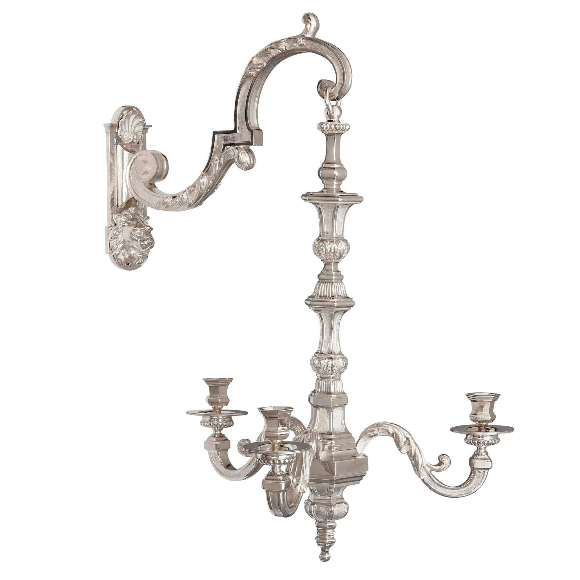 Two 19th century French neoclassical style three-branch wall lights
French, 19th century
Dimensions: Height 80cm, width 47cm, depth 50cm

Designed in the elegant French Neoclassical style, this pair of three-branch wall lights are crafted from