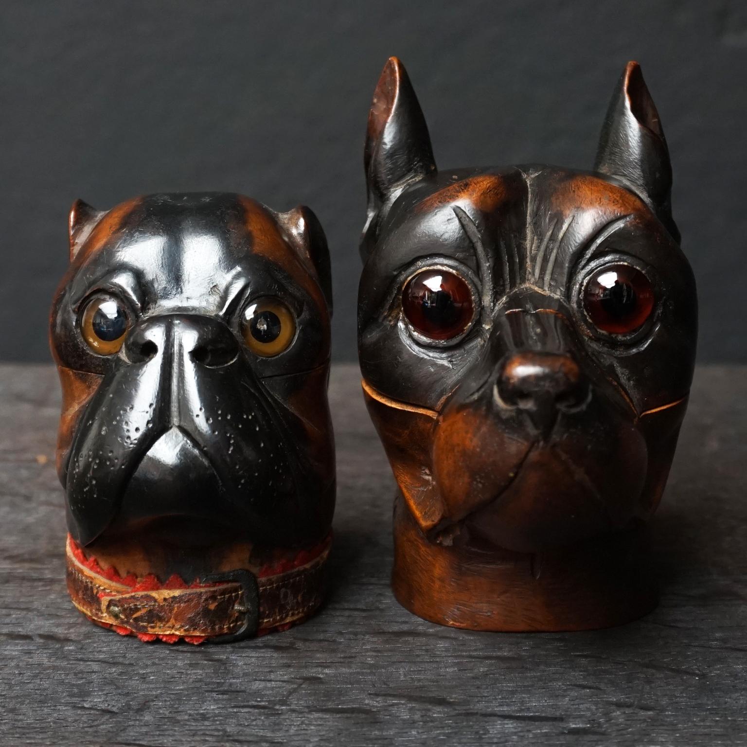 Set of two very beautiful original 19th century carved heavy wooden Victorian era dog inkwells with hinged head that opens to reveal the inkwells inside. They are made of heavy Lignum Vitae or Pockwood, they both have glass eyes.

The bulldog has