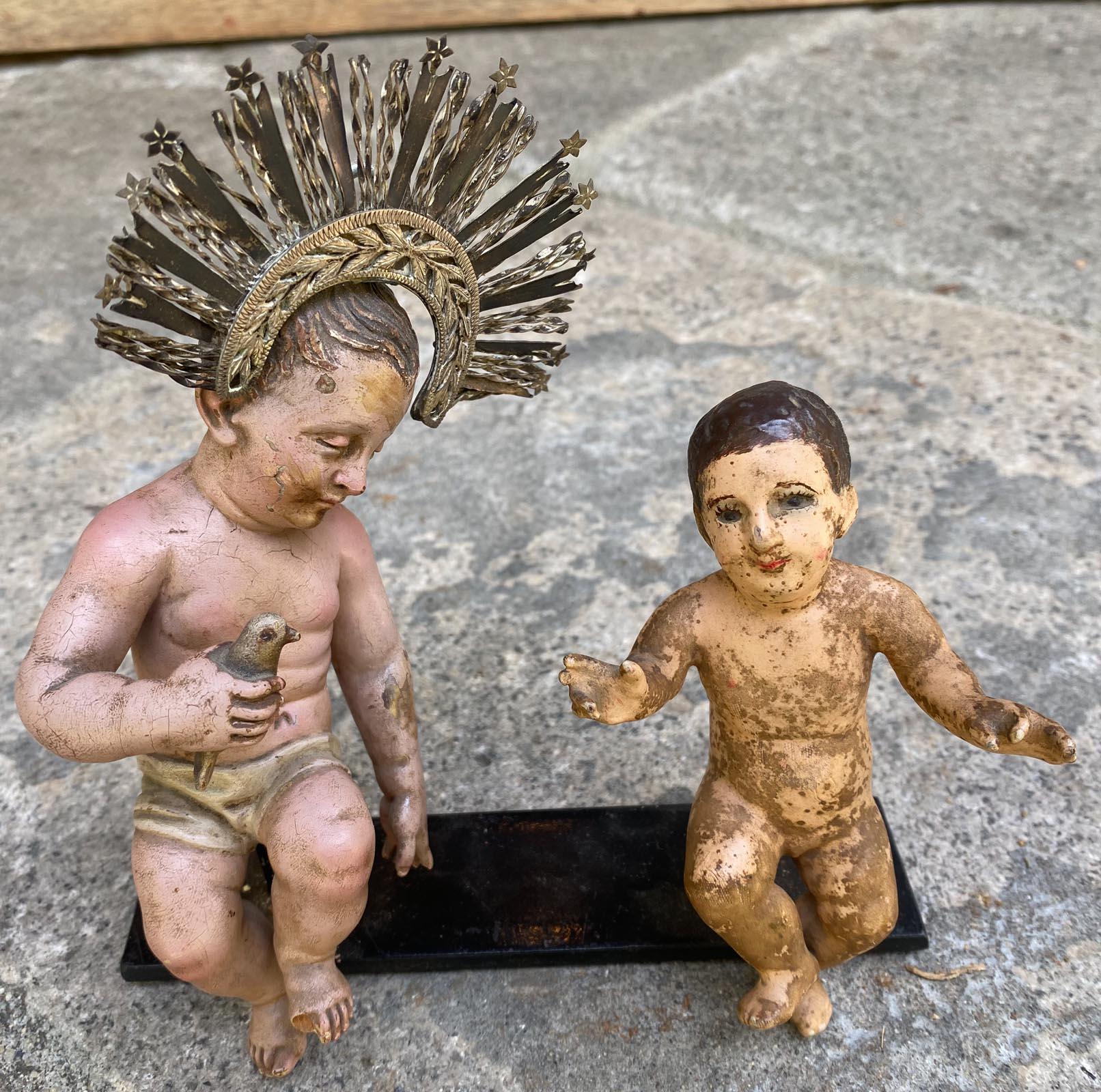 This listing is for one of two 19th century Ninos. If you 'd like to purchase just one. Please specify “Left Niño” or “Right Niño” if purchasing individually.

Left Niño – Sleeping Christ Child with Bird (3.5 x 2.5 x 7 in):
Origin: Guatemala 