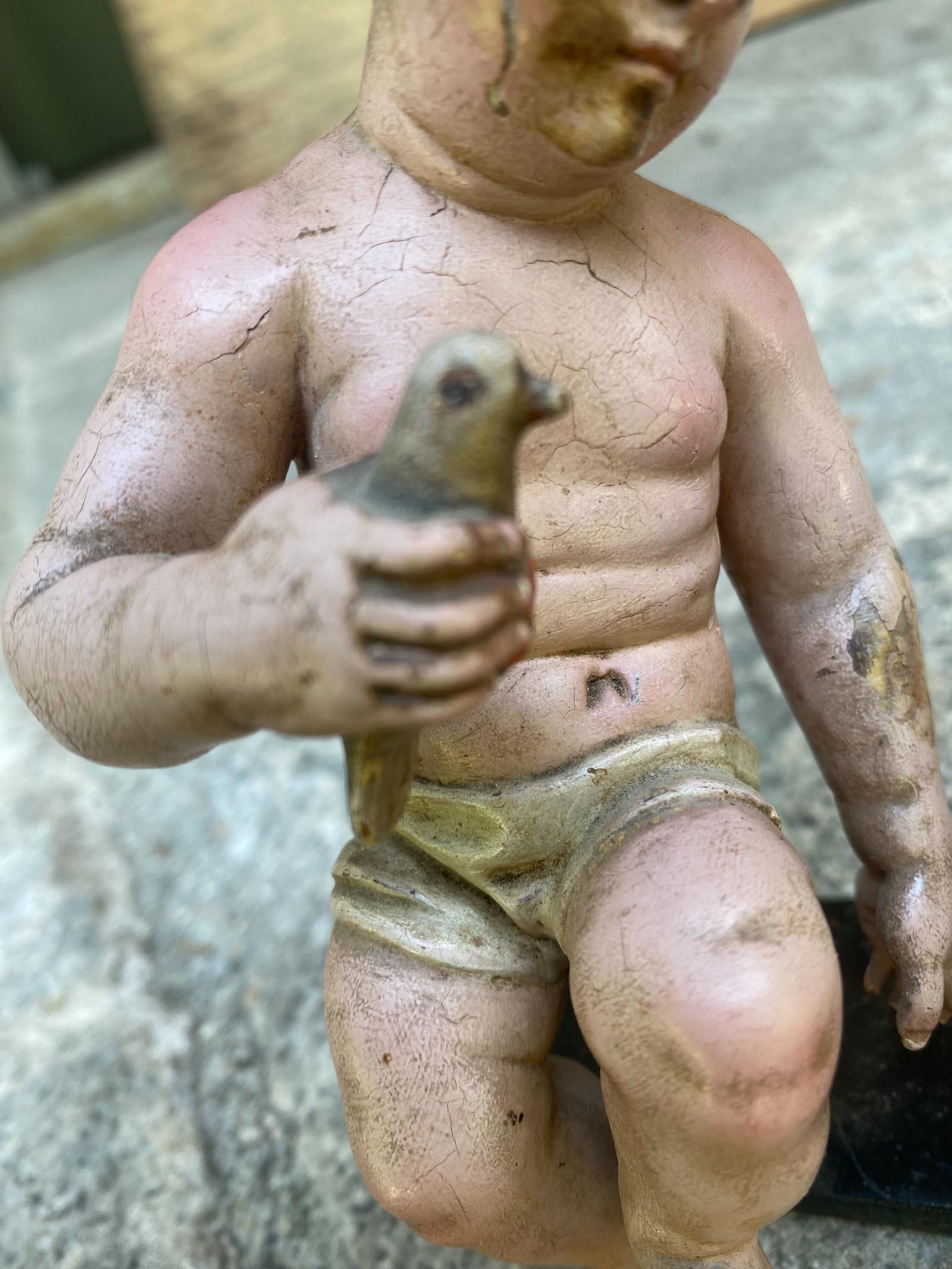 Two 19th Century Polychrome Ninos - Sleeping Holding A Bird In Fair Condition For Sale In Los Angeles, CA