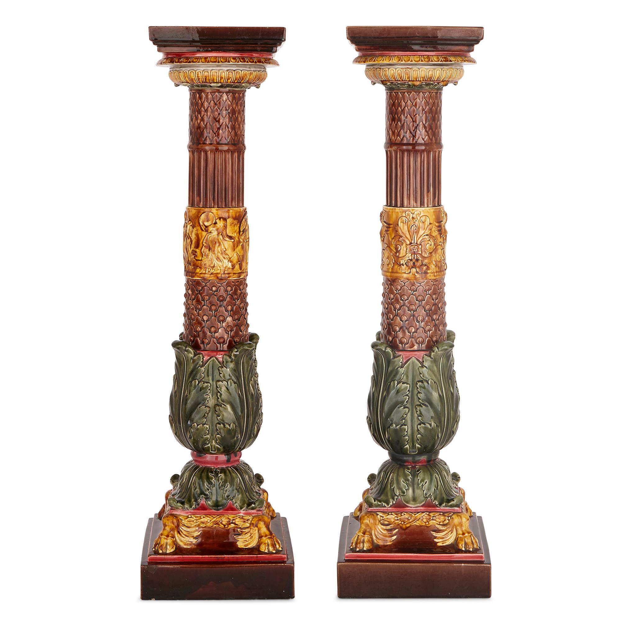 These charming majolica stands (or pedestals) were crafted in the late 19th century by the French Sarreguemines factory. Sarreguemines pottery was characterized by its use of organic colors and ornament, as exemplified by these pedestals. Napoleon I