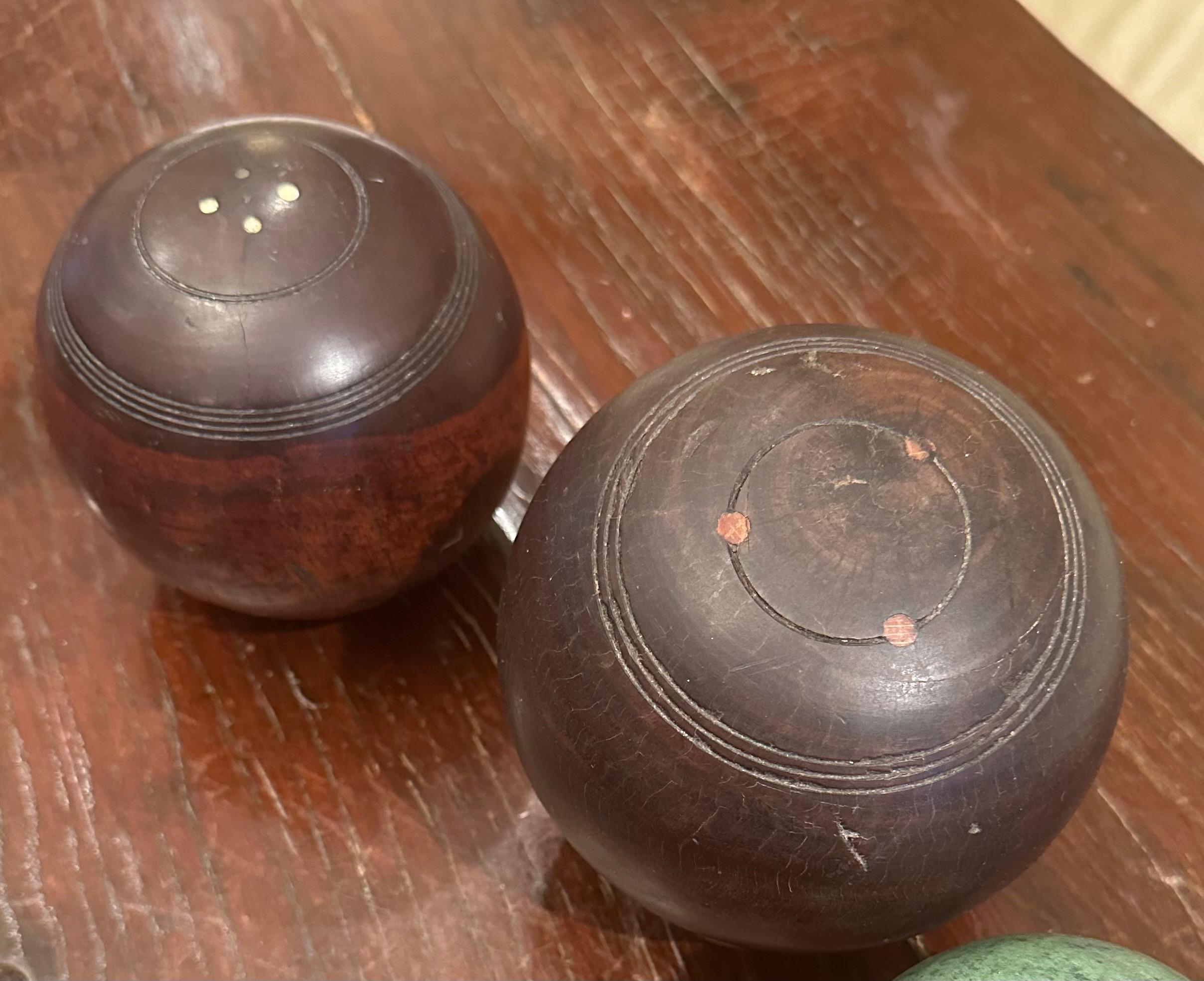 Two 19th Century Scottish Lignum Vitae Carpet Lawn Balls.

These Scottish carpet bowling balls are made from beautiful tropical lignum vitae wood. Each ball has carved incised rings and inlaid bone plugs. It is a true testament to timeless