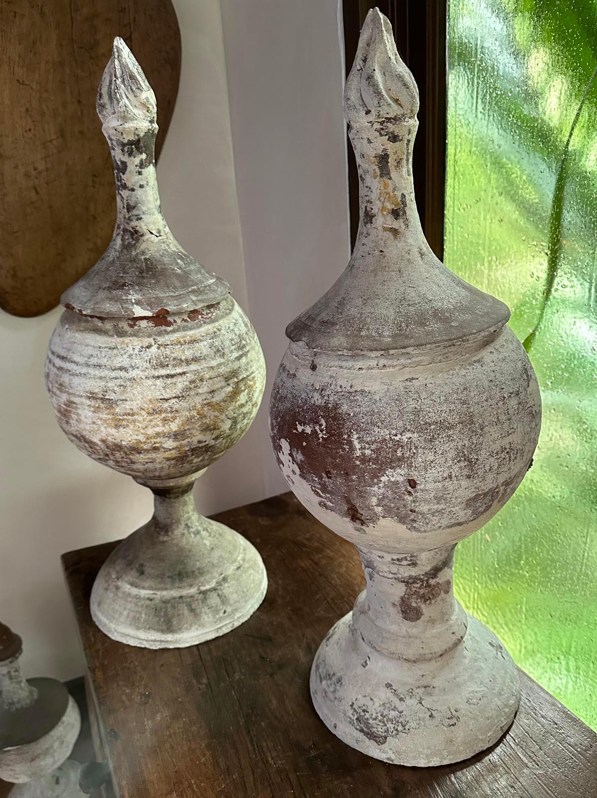 This listing is for two 19th century terra-cotta finials with old gesso, great flames adorn the tops. Please note that the bases are slightly different.
These sat on pre 1825, Spanish Colonial houses. Top lifts off. From the high Highlands of