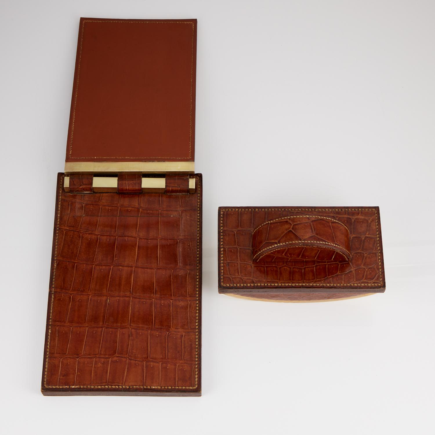 Two beautiful and desirable vintage desk pieces by the most famous luxury brand, the crocodile skin still has its original sheen and is in very good condition.

Both pieces have stitching on the outer edges.

Measures: Blotter W 7 1/4” x H 4” x