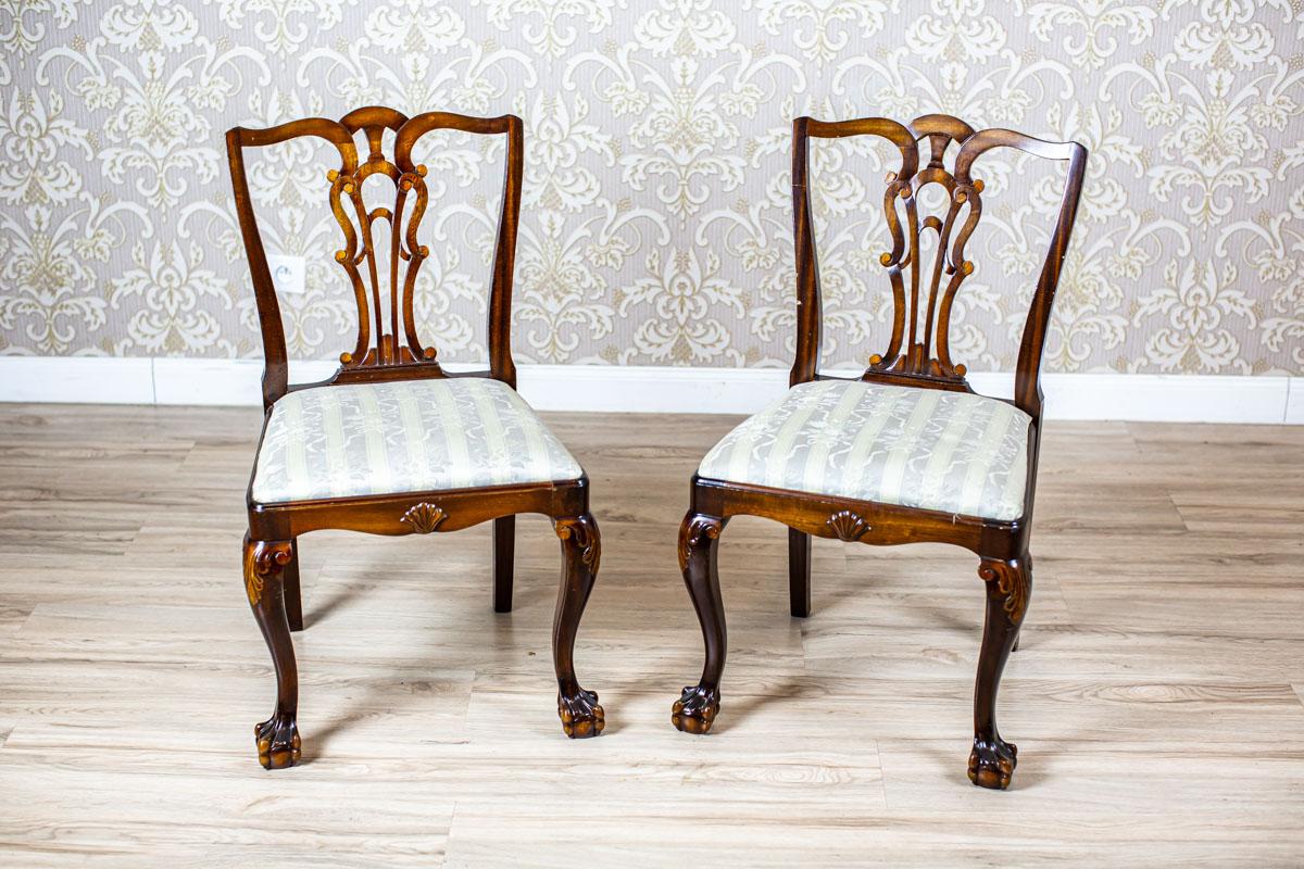 Two 20th-Century Chairs in the Chippendale Type Veneered with Walnut

Presented pieces of furniture, circa 1950, are based on the furniture in the style of English Rococo, which had been introduced by T. Chippendale in the 18th century.
Furthermore,