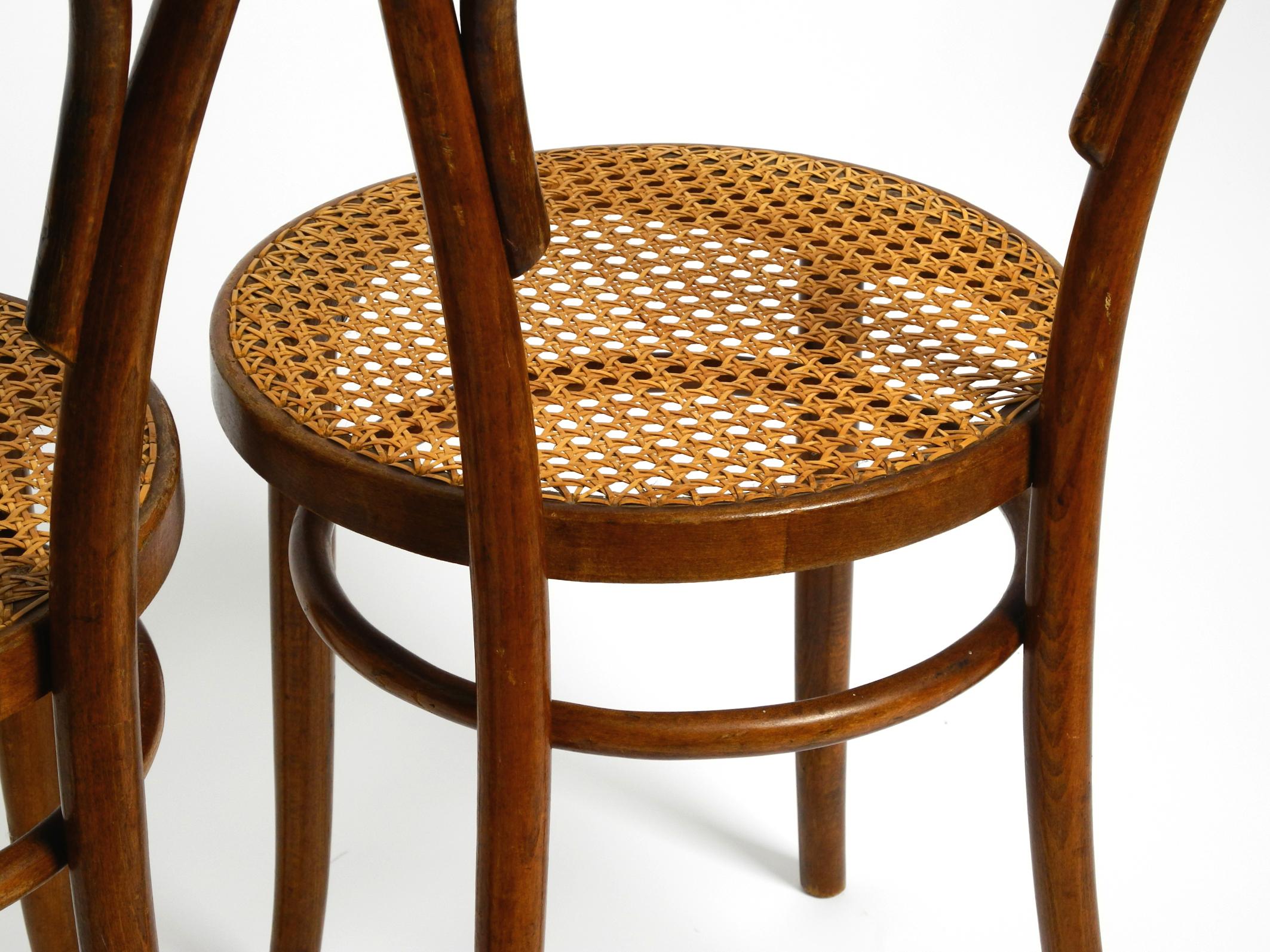 Two 30s coffee house chairs made of bentwood with cane weave by ZPM Radomsko 9