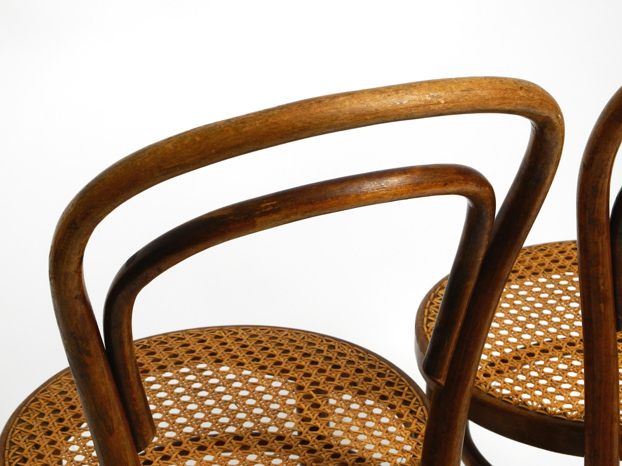 Two 30s coffee house chairs made of bentwood with cane weave by ZPM Radomsko 10