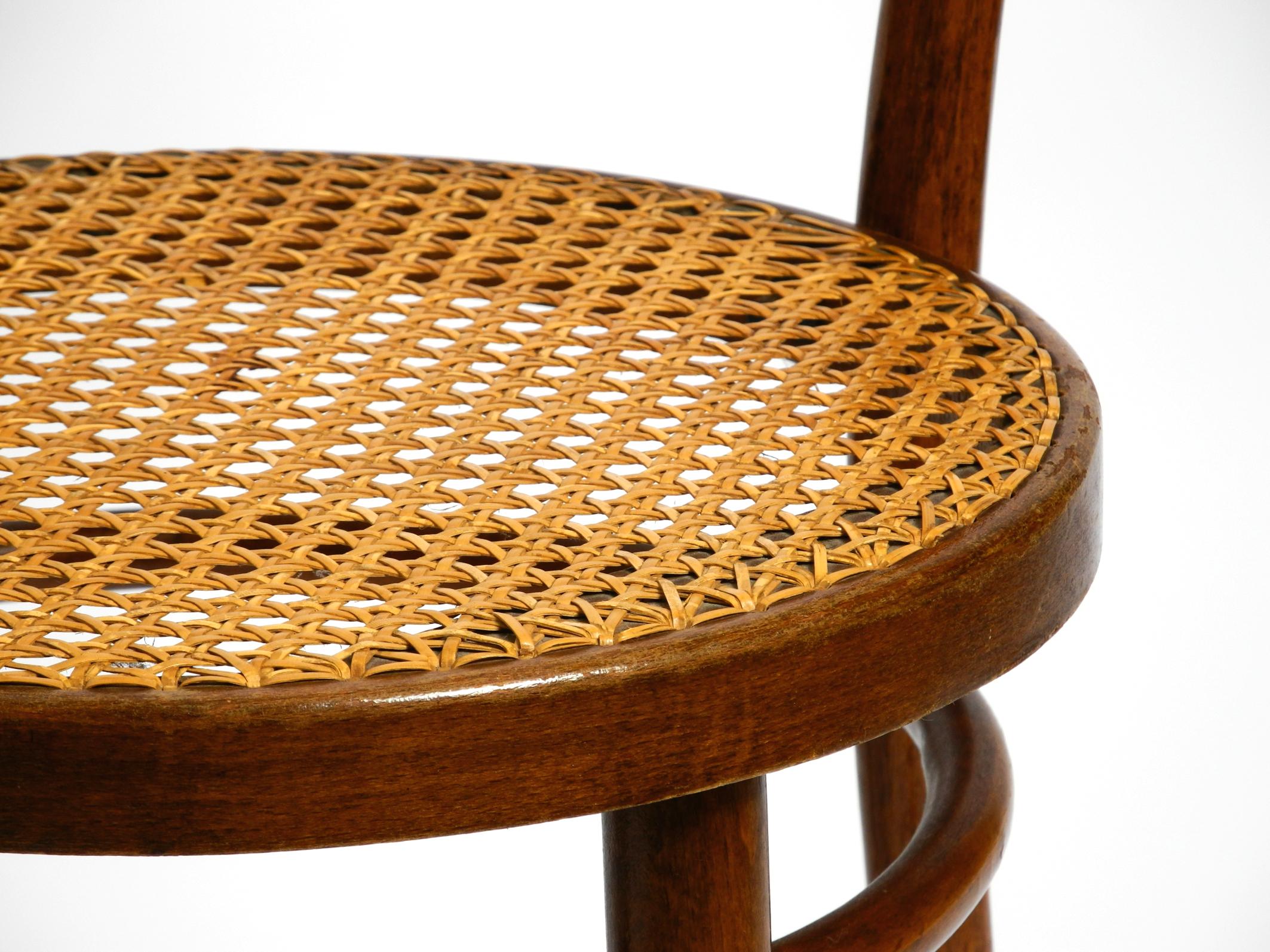 Two 30s coffee house chairs made of bentwood with cane weave by ZPM Radomsko 12