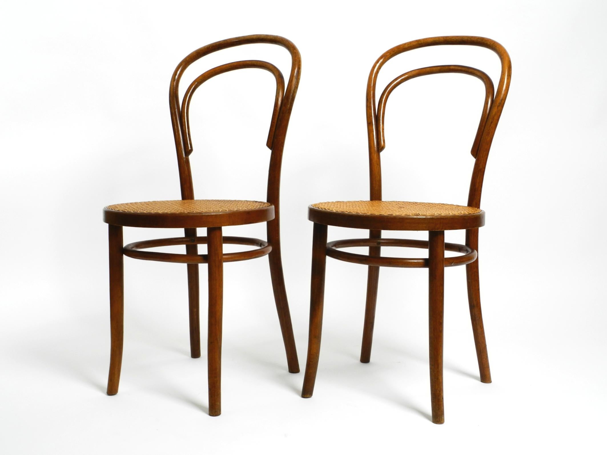 Two original 1930s coffee house chairs made of bentwood with reed weave.
Manufactured by ZPM Radomsko. A former Thonet factory. Made in Poland.
Both chairs are in almost perfect original condition. No damages at all.
Undamaged original weave on the