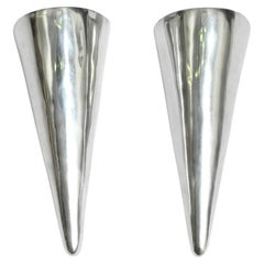 Two 80s large Postmodern wall lamps made of polished cast aluminum by Lucien Gau