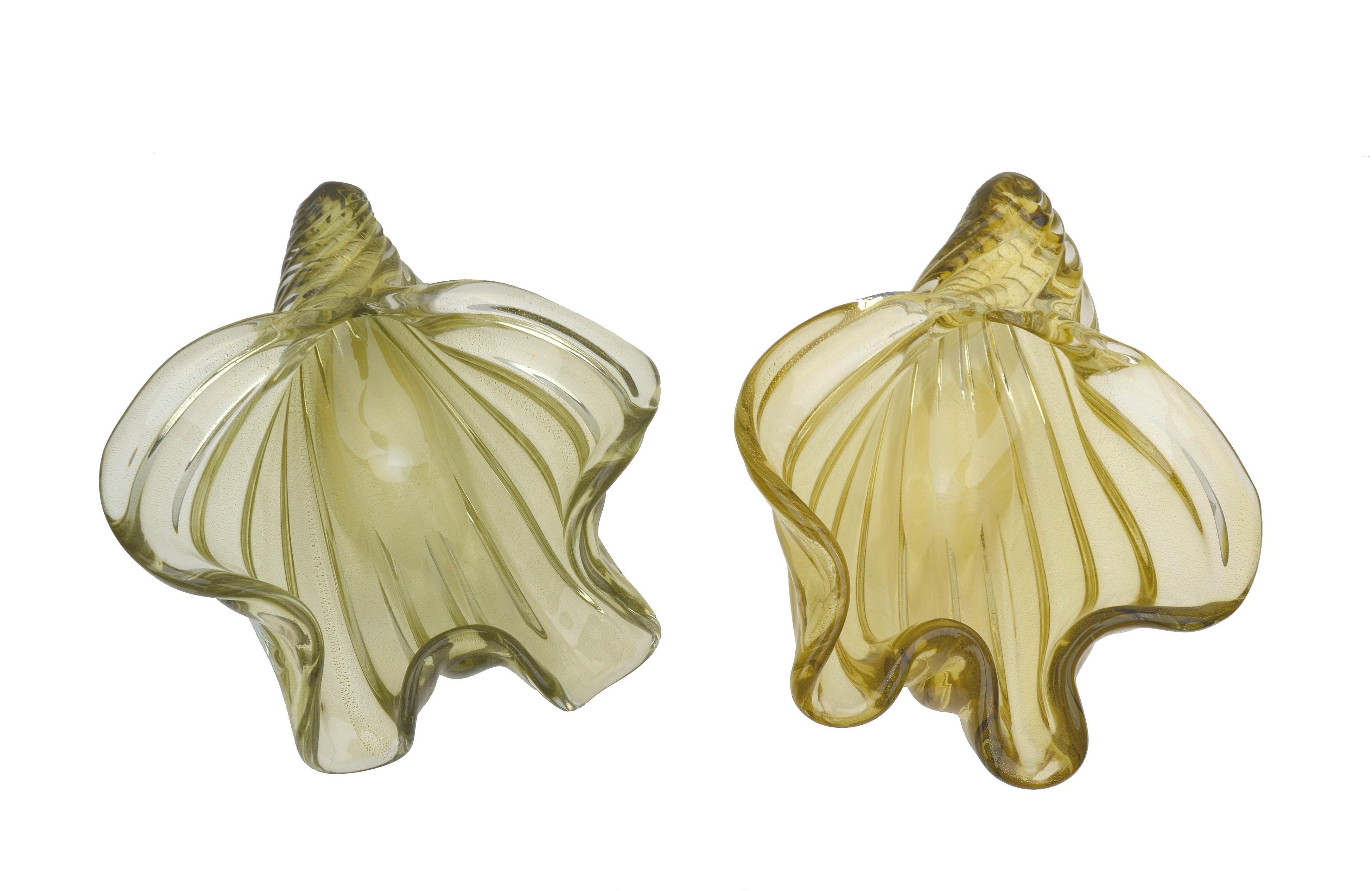 Two beautiful ruffled and spiraled Chartreuse colored glass pieces with small gold colored flecks trapped inside, evidence of the avventurina (Aventurine) technique, by Alfredo Barbini (Italian, 1912-2007). Pale olive bowl dimensions, 7