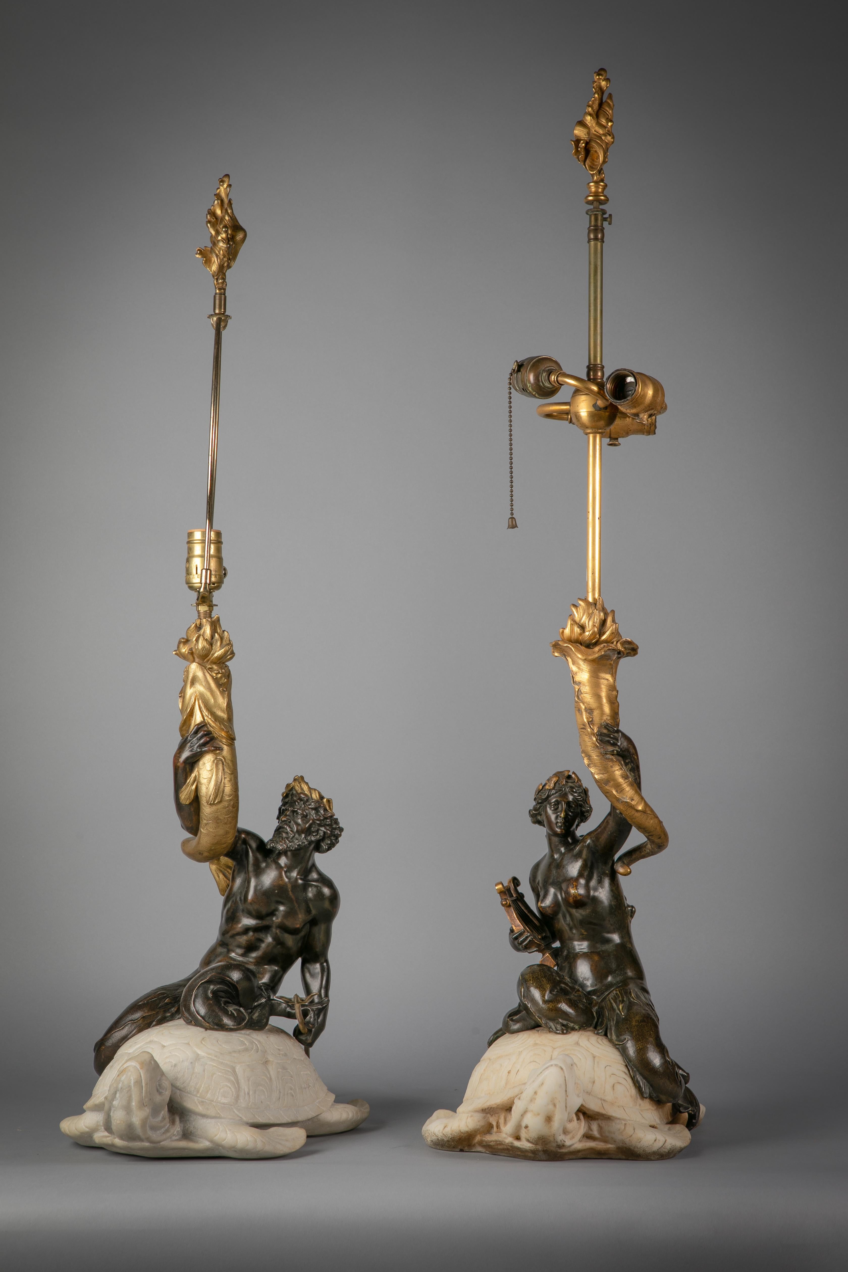 Modelled as Amphitrite and Poseidon each mounted on a marble sea turtle.