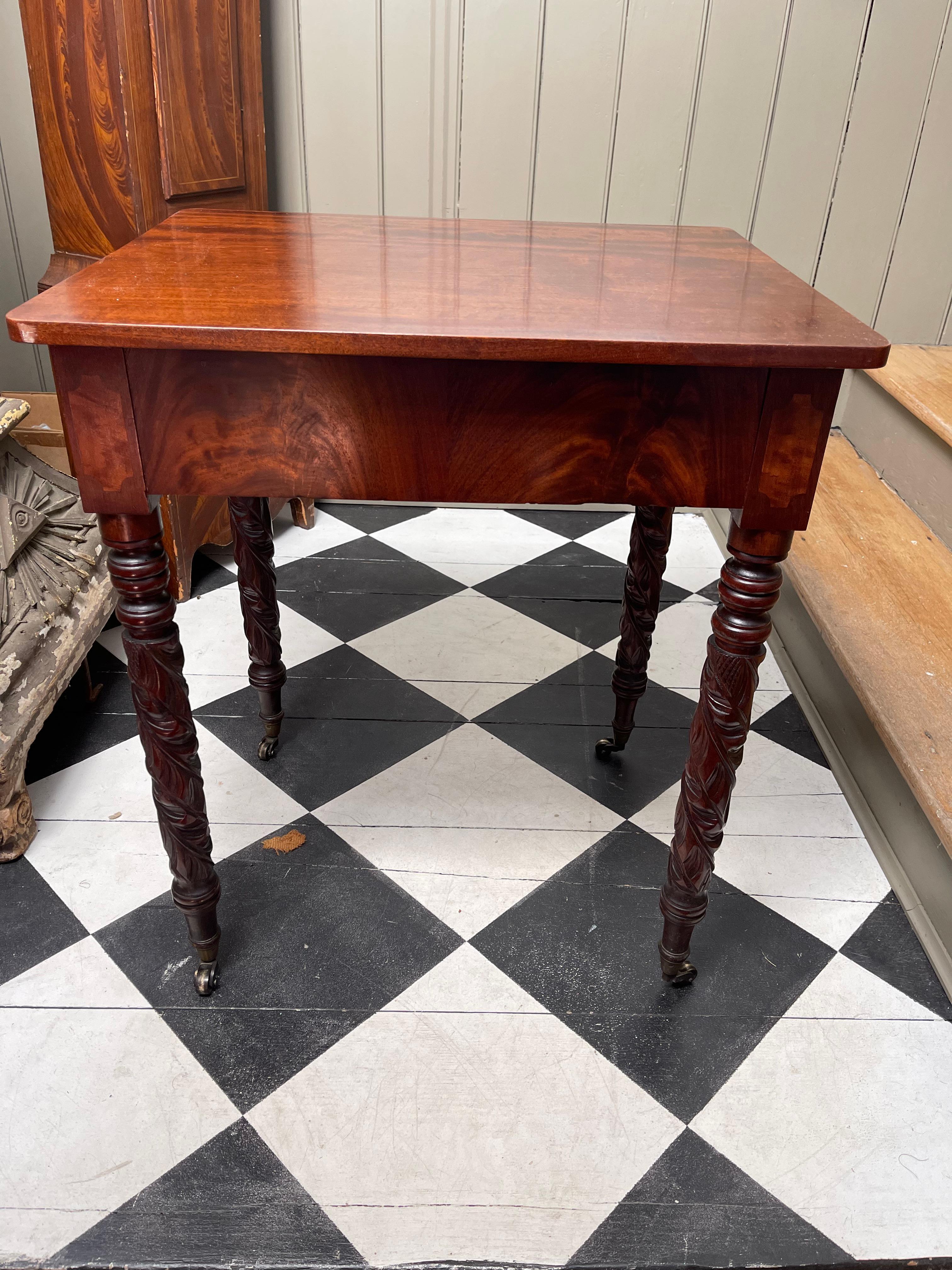 Two Late Federal Style Side Tables. Mahogany with beautiful New England carved and tapered legs. No drawers.

This similar pair were adapted from possibly a dining table, using all period elements to create them.