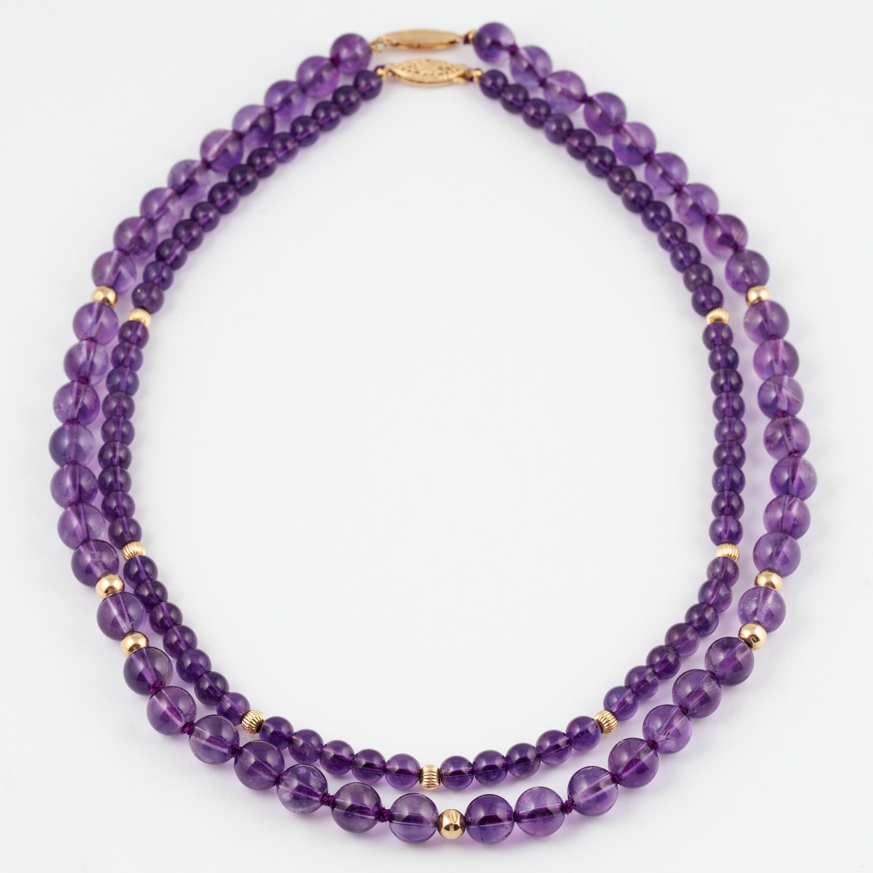 Two amethyst necklaces from the 1980s of deep violet color, one consisting of 48 8mm natural amethyst beads enhanced by 5 mm polished gold beads and a gold clasp; the other consisting of 68 6mm natural amethyst beads enhanced by 4 mm fluted gold