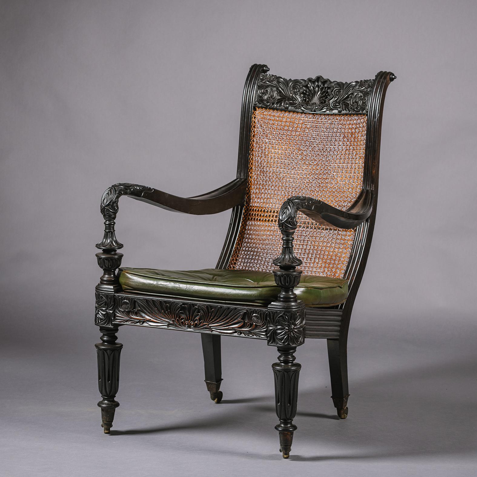 Two Anglo-Indian Carved Ebony Easy Armchairs For Sale 1