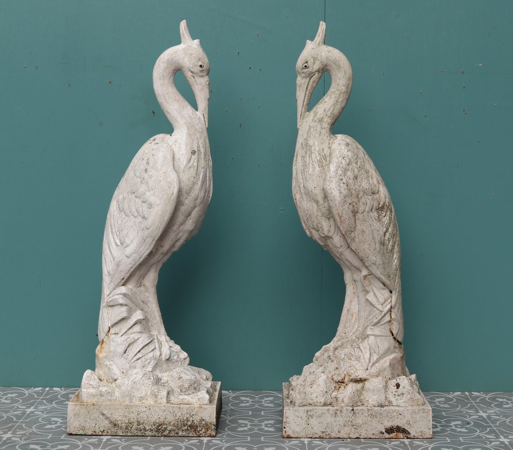A pair of large antique cast iron heron figures standing on naturalistic bases.
 
Additional Dimensions
 
Base 30 x 23 cm