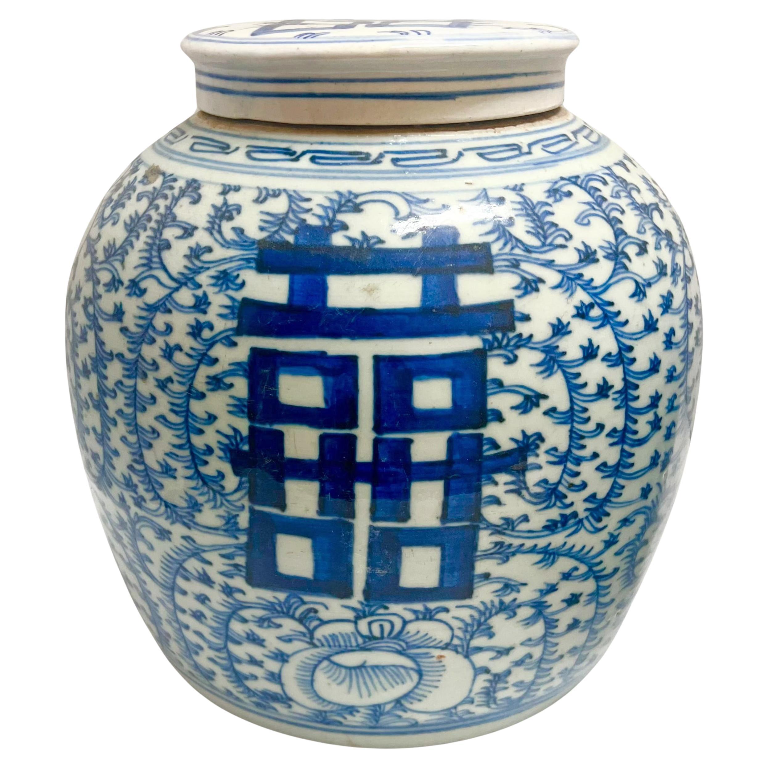 A set of two antique Chinese Qing Dynasty blue-white covered porcelain ginger-style jars, circa late 19th century.  Various heights between 9 to 11
