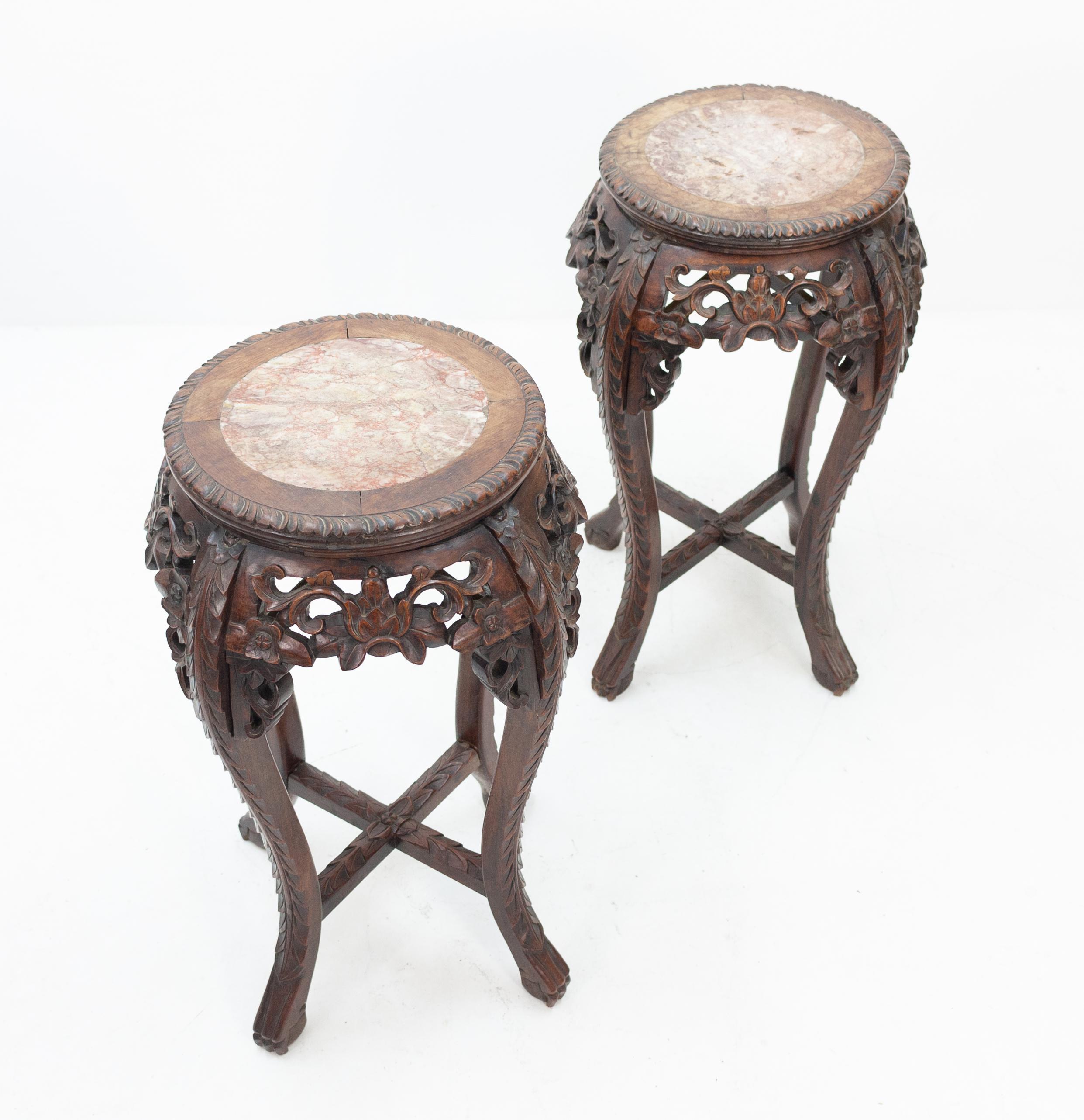 Matching pair of richly decorated hand carved plant stands with marble top surfaces. Good quality and condition, 19th century.