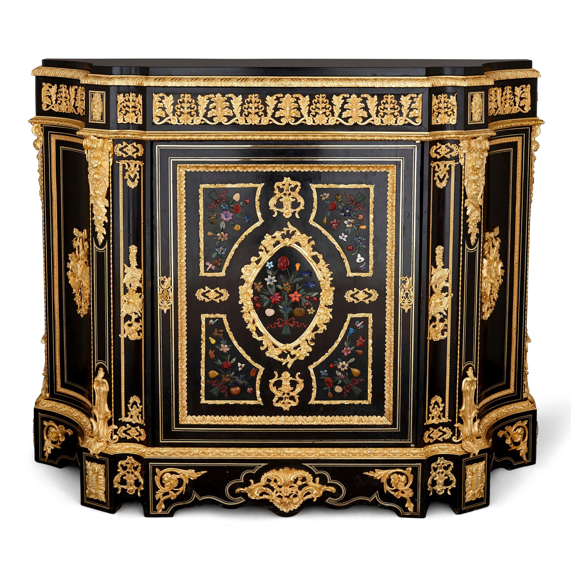 Two antique ebonized wood and ormolu cabinets with hardstone Pietra Dura inlay
French, late 19th century
Dimensions: Height 112cm, width 135cm, depth 43cm

This fine pair of cabinets are designed in an eclectic late 19th century French style,