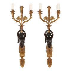 Two French Gilt and Patinated Bronze Sconces