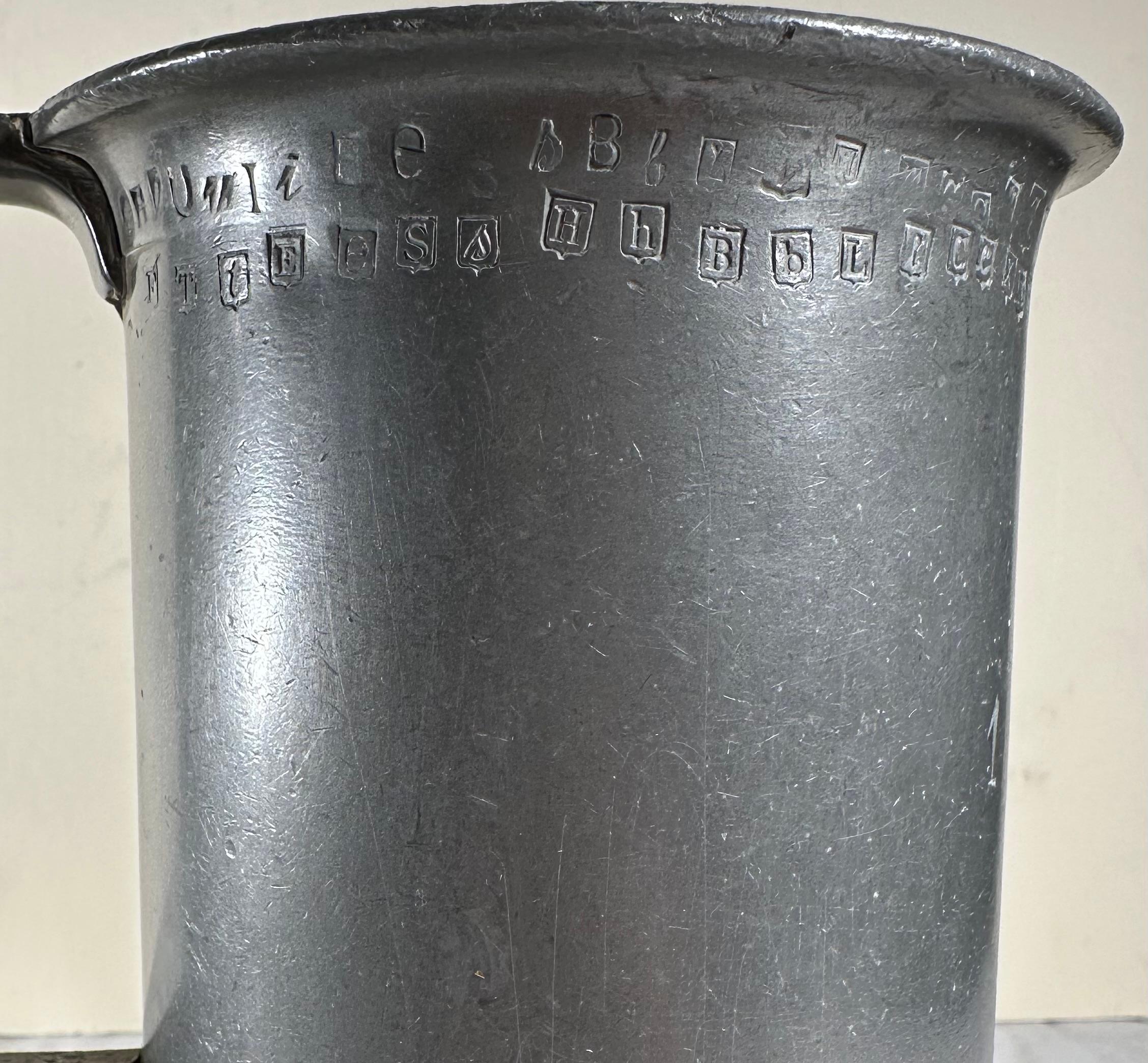 Two Antique French Heavy Pewter Measuring Tankards

Two 1-liter pewter measures from France circa 1850. Both are hallmarked on the bottom. The rims of the tankards are marked with calibration punch stamps. Verification marks signify that the measure