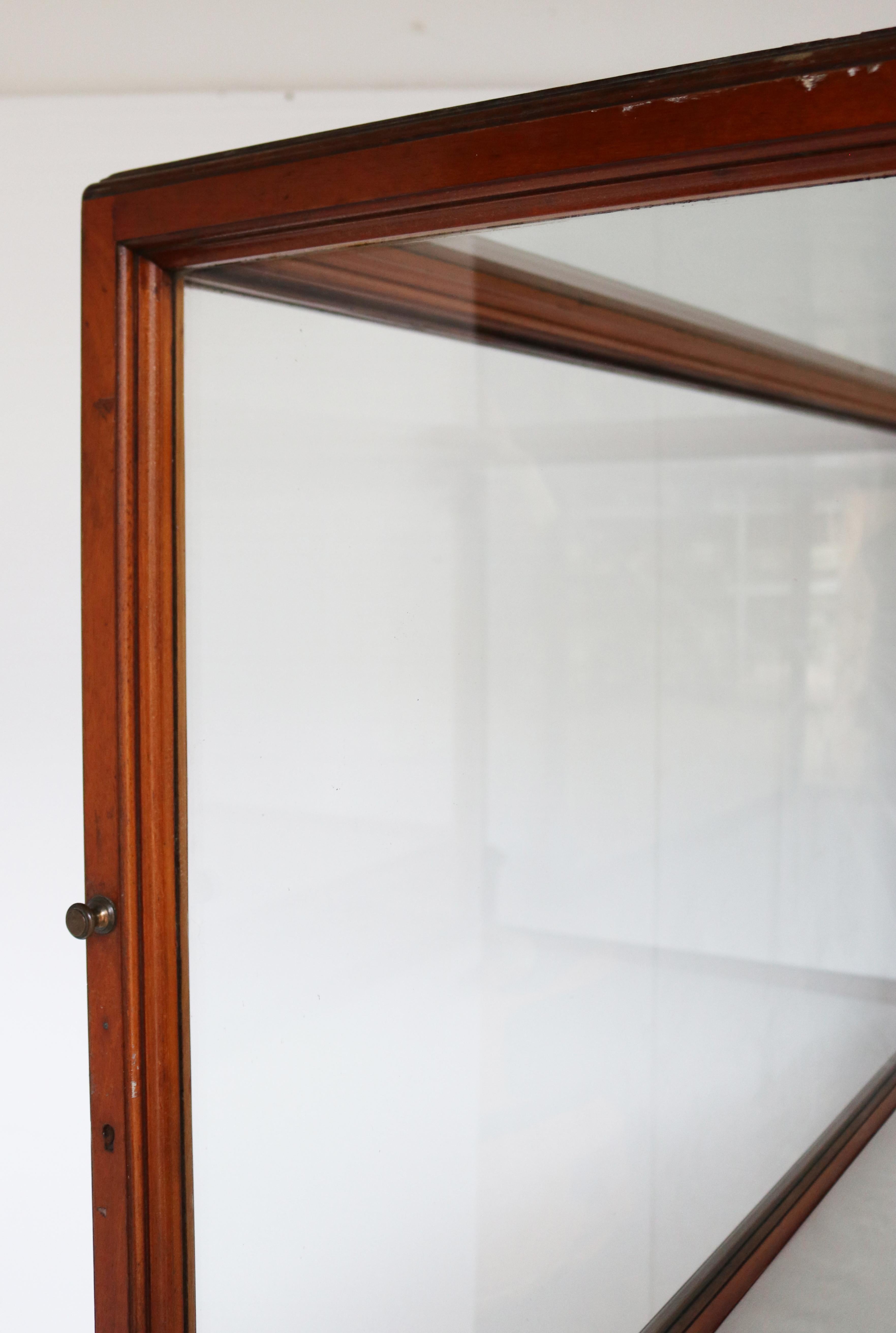 A superb pair of large antique glazed mahogany museum display cabinets from the V&A Museum, London. There are doors to each end, opening opposite to each other.

Price is for each display cabinet. The Dodo skeleton is not included.

The V&A