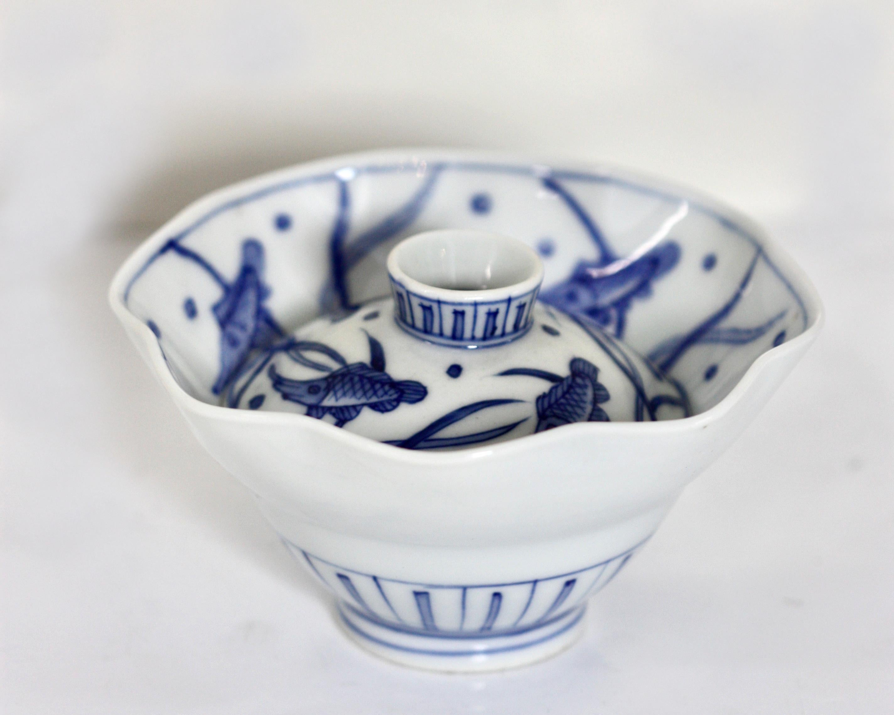 Two antique Japanese Shunga (erotica) works of art. 
One a shallow dish with explicit detail and evidence of the Kutani studio, 
Diameter 7.5 in. (19.05 cm.) 
The other a hidden shunga as a fluted covered bowl, the exterior in cobalt underglaze