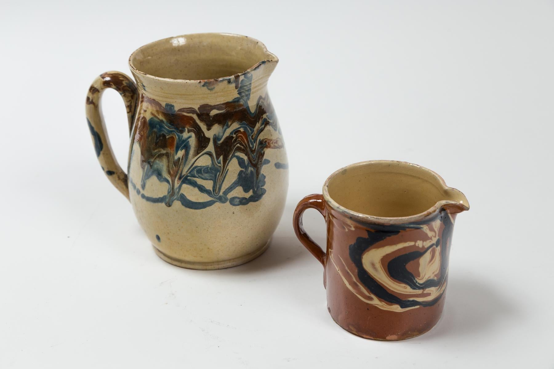 French Provincial Two Antique Jaspé Pottery Pitchers, France, Late 19th Century For Sale