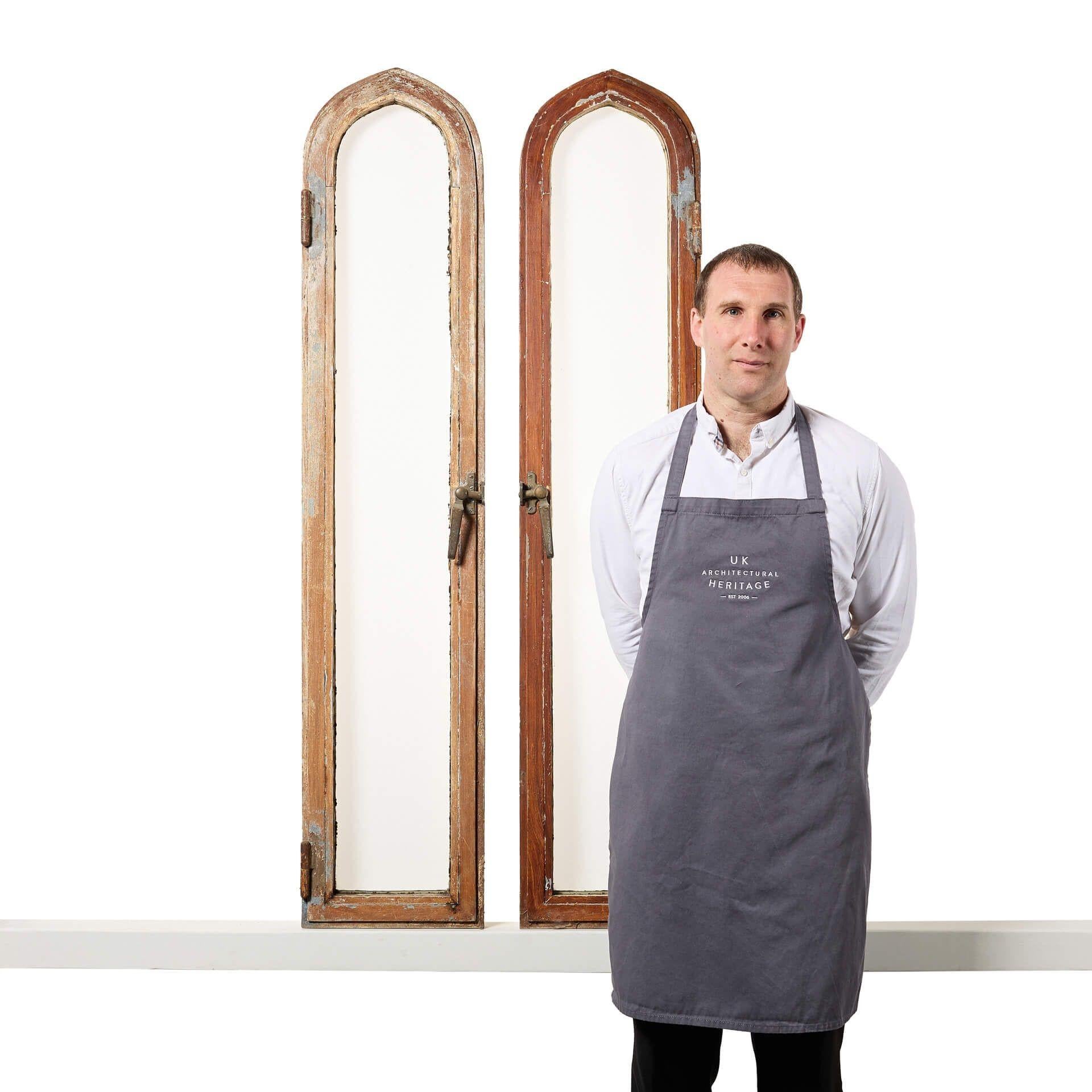 Two 1.51m tall (5ft) antique lancet windows, reclaimed from a country house near Haywards Heath. Constructed from zinc, these windows open fully, fitted with thick clear glass panes and bronze handles.

A handsome pair of feature windows to