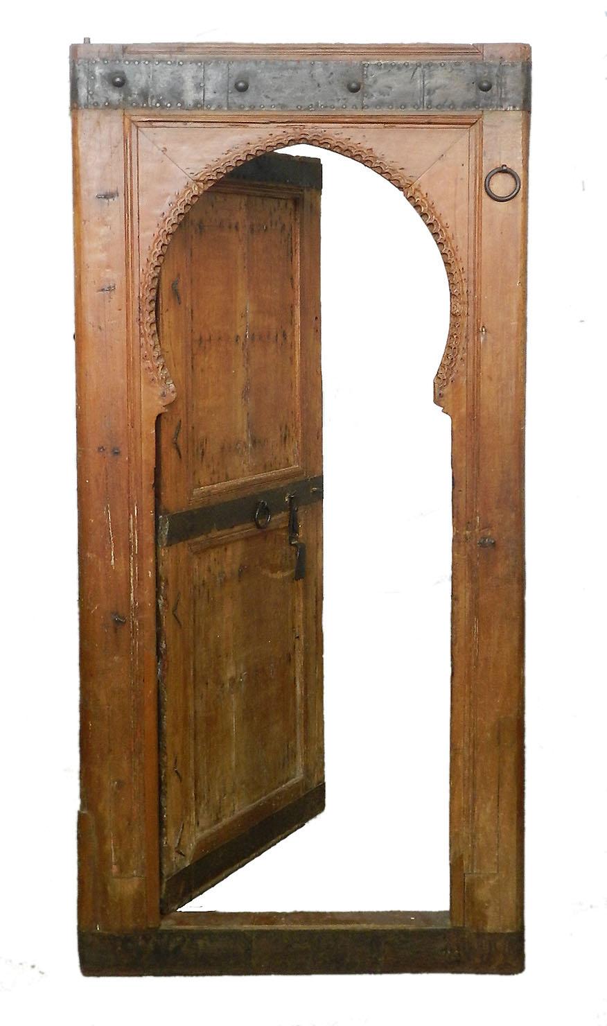 Two antique Moroccan arched doors 19th century Moorish
Hand carved wood
Hand forged iron door furniture
Decorative and stunning interior design pieces
Perfect for incorporating in design and building projects
In very good antique condition and both
