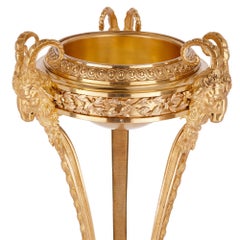 Two antique Neoclassical style gilt bronze tripod stands