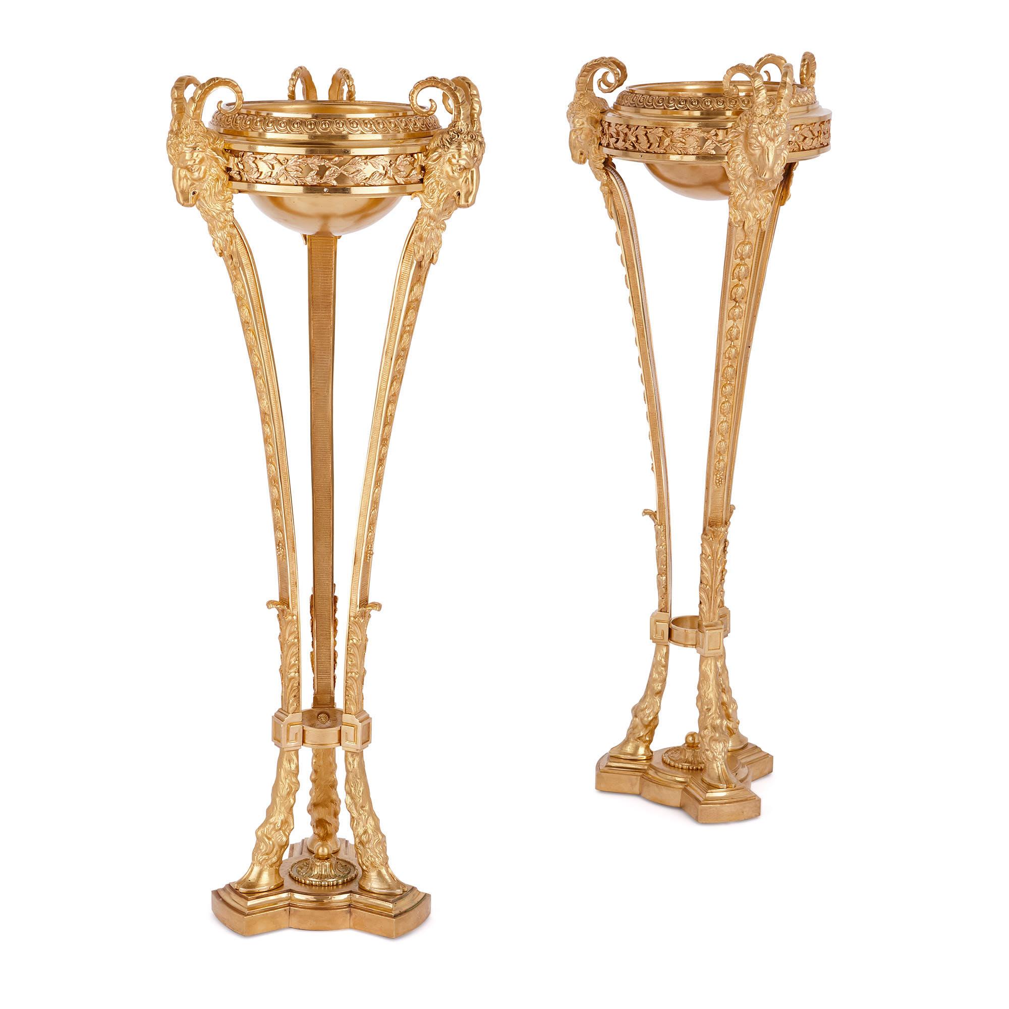 Two antique Neoclassical style gilt bronze tripod stands  For Sale