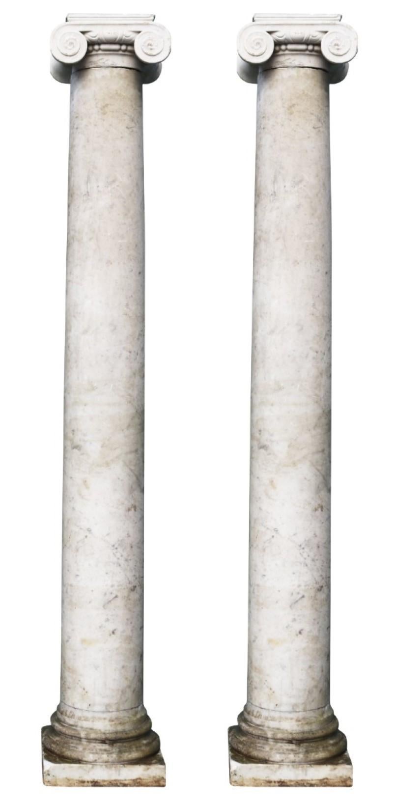 Two lightly veined Ionic order marble columns. These Georgian period columns were reclaimed from a property in Surrey.

Additional dimensions:

Height of columns- 206.5 and 208 cm

Base section 33 x 33 cm

Top section 24 x 23.5 cm.