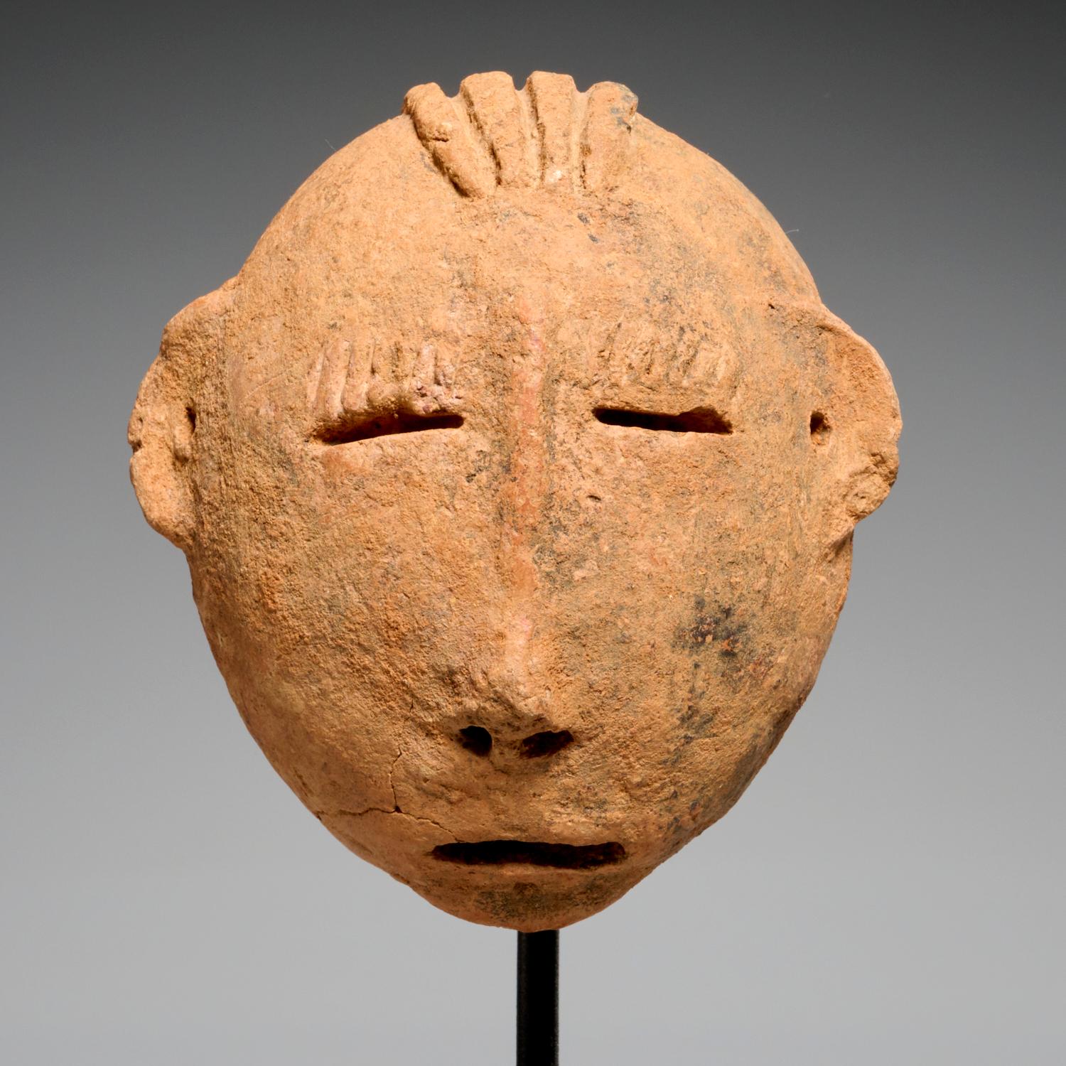 Bura fired clay heads, possibly 3rd-10th c. CE, Niger, Bura peoples. These are very expressive examples on custom mounts, the larger with manganese deposits.

Between the 3rd and 10th centuries, the dead were laid to rest at a site in present-day