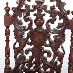 Due antiche poltrone armoriali rinascimentali in noce reticolato C1870