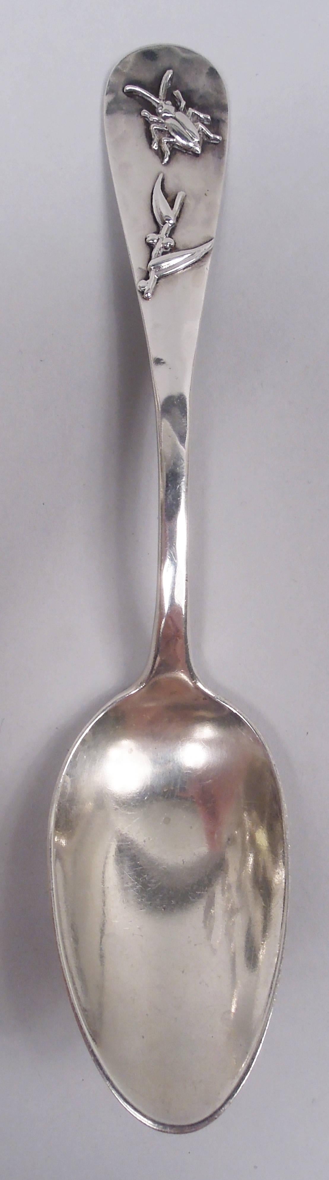 Japonesque sterling silver spoon. Made by George W. Shiebler & Co. in New York, ca 1885. Tapering stem and round terminal; front hand-hammered and applied with a bug and bit of bamboo. Oval bowl. Back plain. Fully marked including maker’s and
