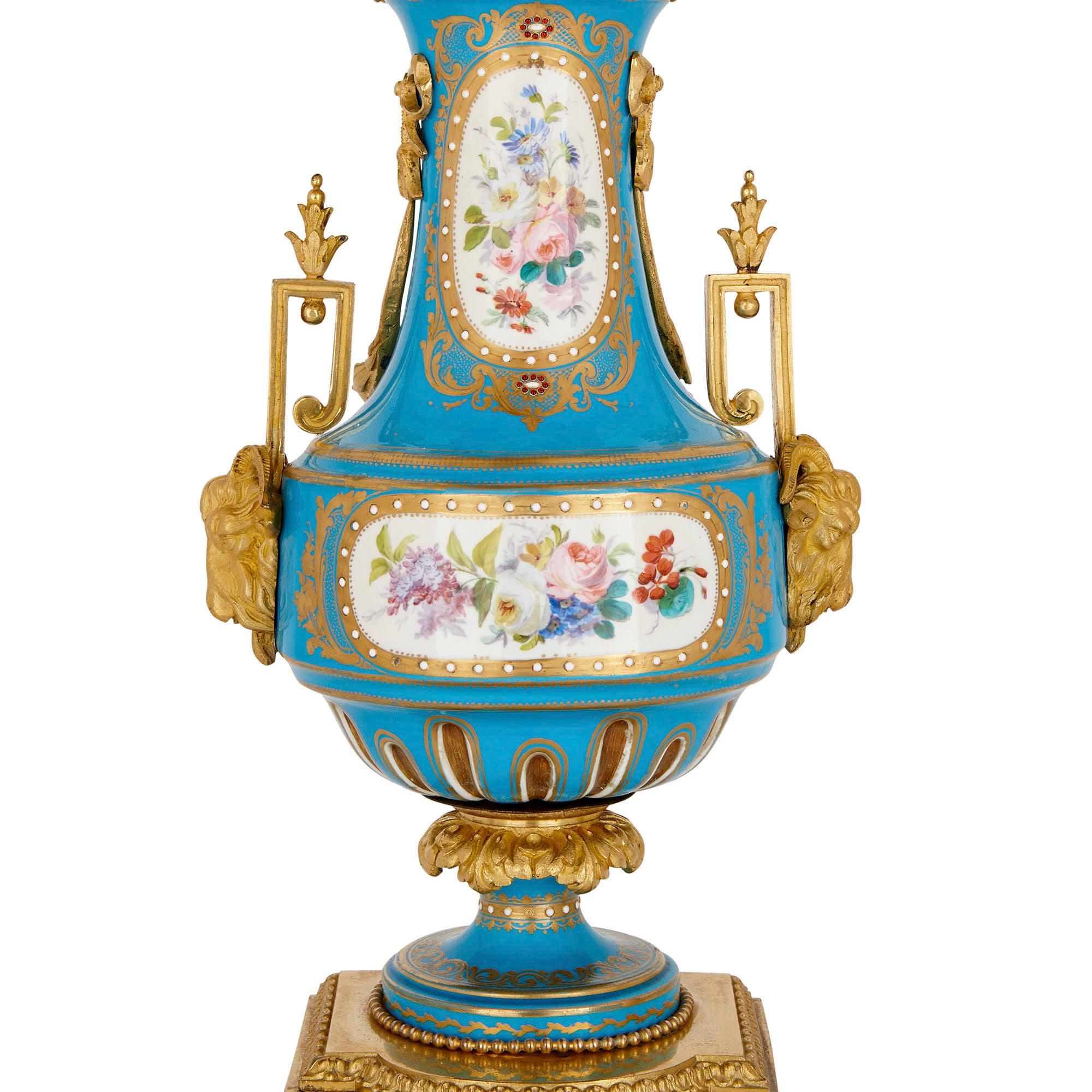 These wonderful porcelain candelabra were created in the 19th century, after Rococo style decorative arts of the 18th century. In their painted decoration, the candelabra are clearly inspired by Sèvres Porcelain Manufactory items.

Each candelabra