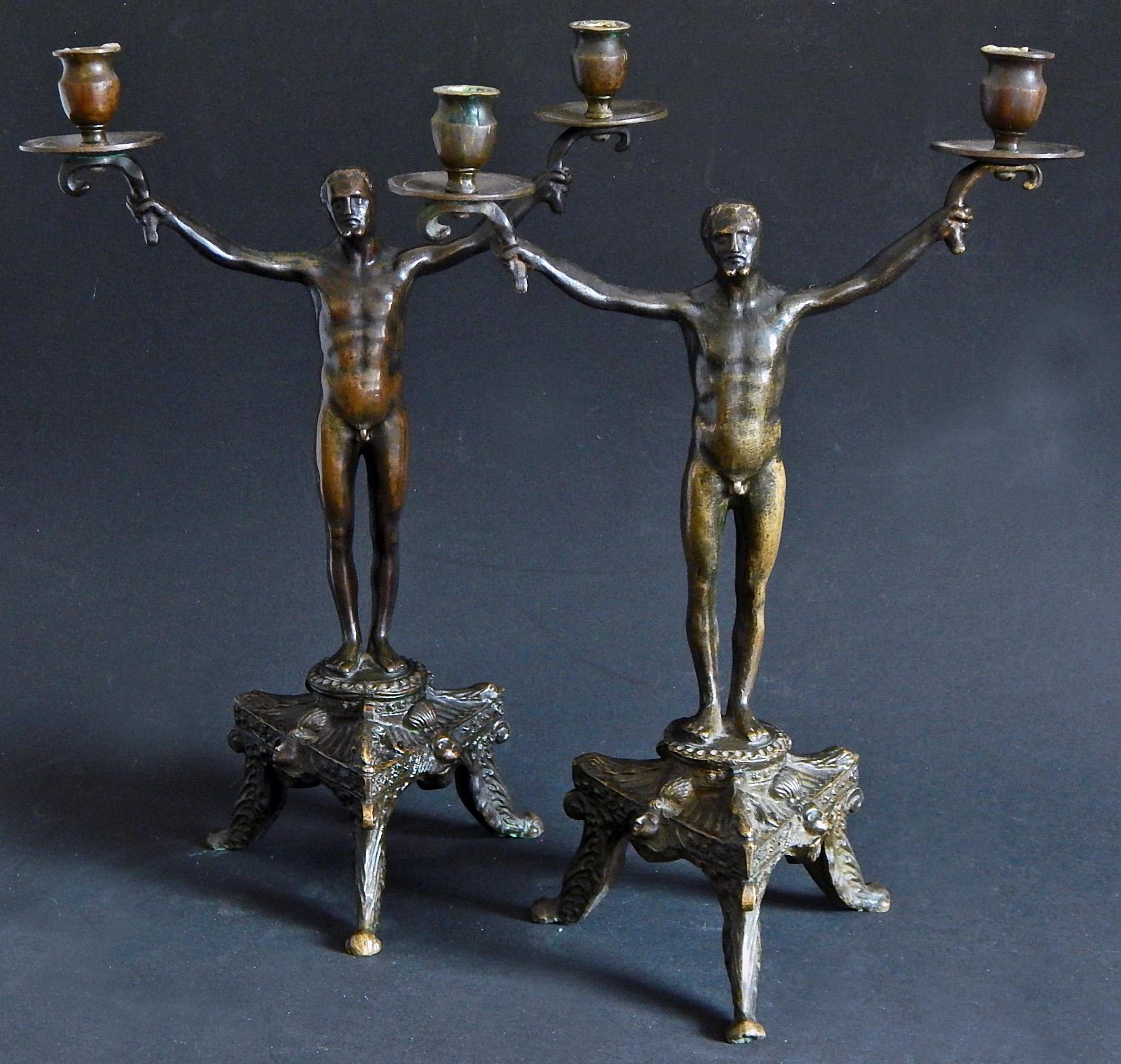 Extraordinary, very fine and probably unique, this pair of Renaissance Revival bronze candelabra were made in Munich (Munchen), Germany, probably at the turn of the 20th century. Mysteriously, they are marked with the HS monogram, indicating either