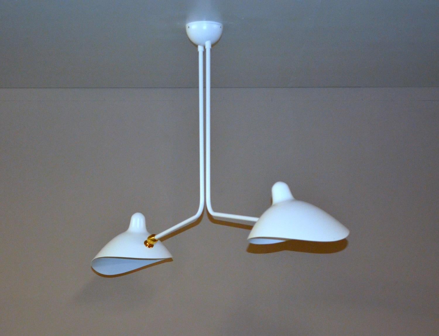 Simple and unique this ceiling lamp has two symmetrical curved arms which are fixed, with shades that can be rotated to any position. An elegant lamp with a small footprint that gives character to any room. 

Available in white or black.