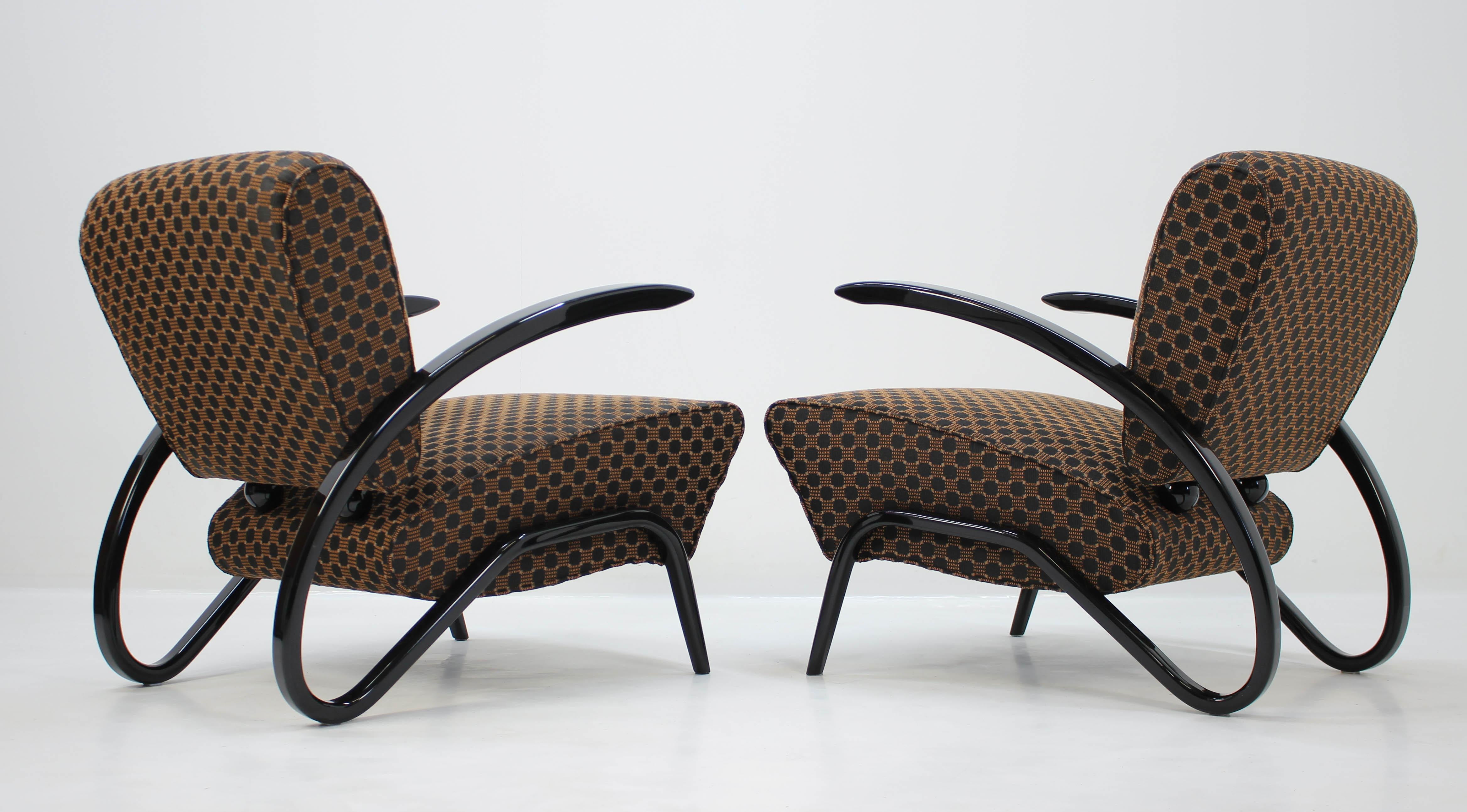 Ultra rare Art Deco armchairs. This is a timeless design and probably one of the very best from renowned Czech designer Jindrich Halabala; made in 1930s. The production was so complicated that it was stopped after only a short period of time. These