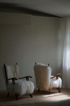 Two Armchairs in Oak & Longhaired Icelandic Sheepskin, Henning Kjærnulf, 1950