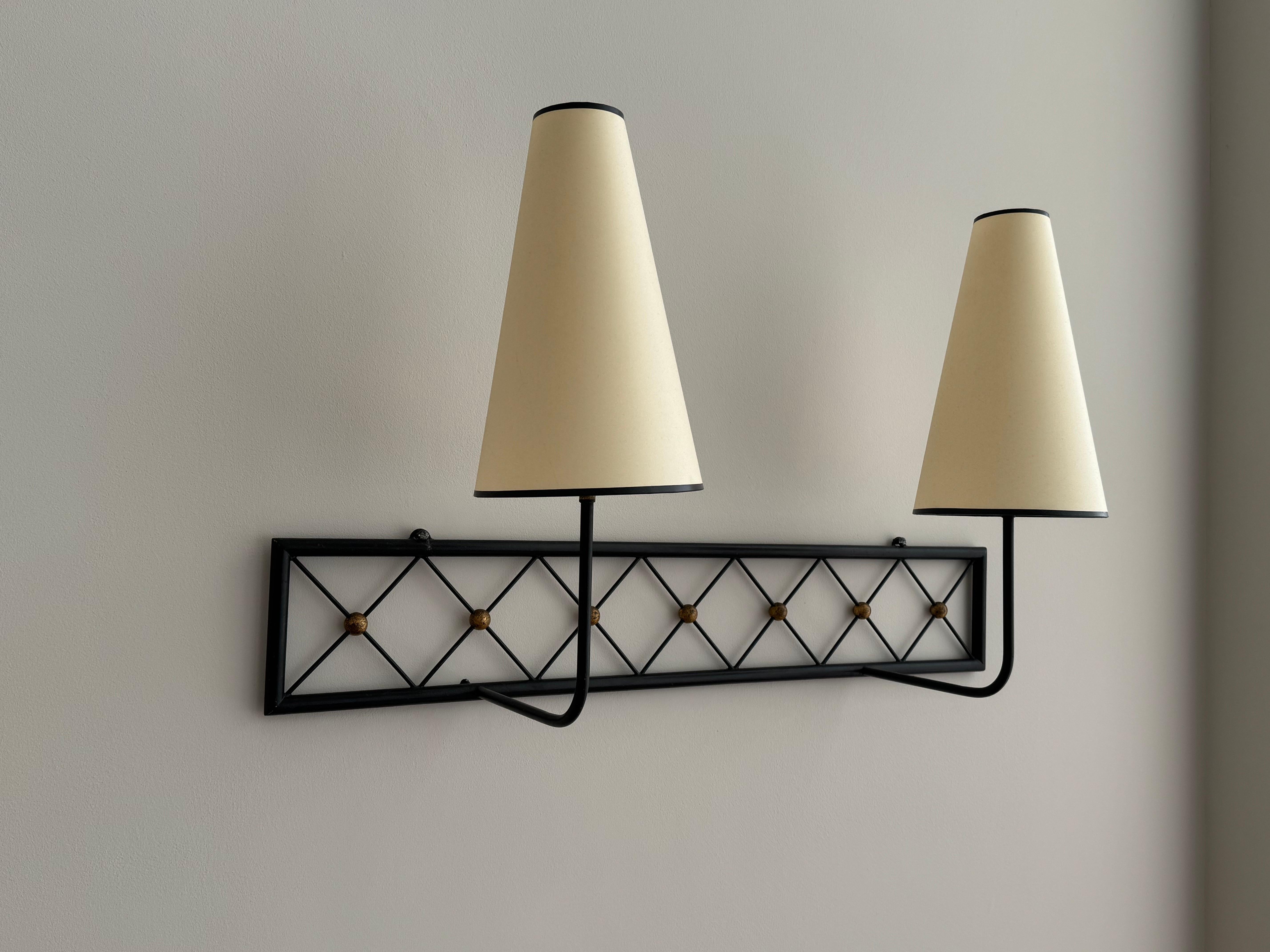 Mid-Century Modern Two-arms Tour Eiffel wall light in black painted and gilt metal For Sale