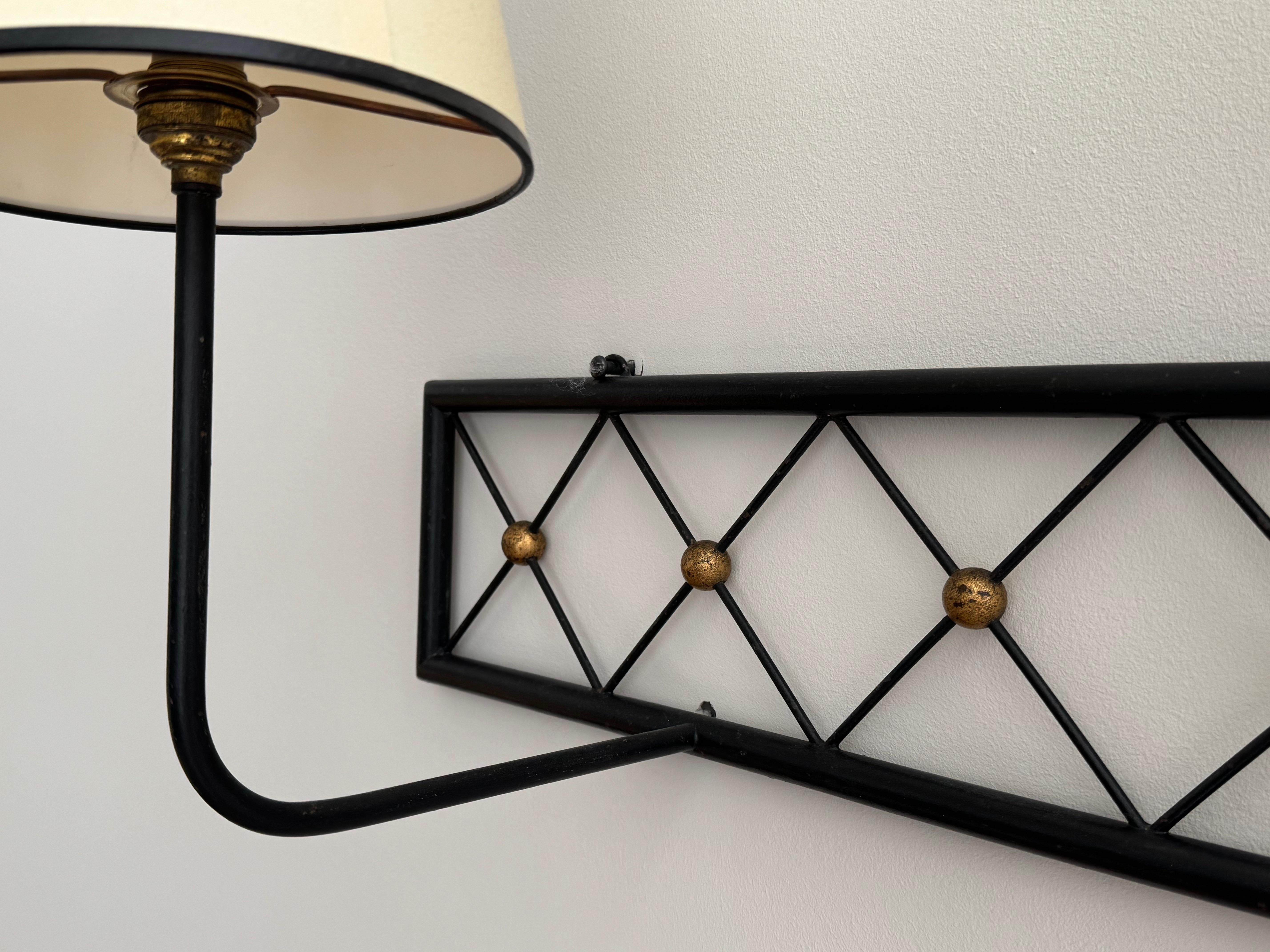 Painted Two-arms Tour Eiffel wall light in black painted and gilt metal For Sale