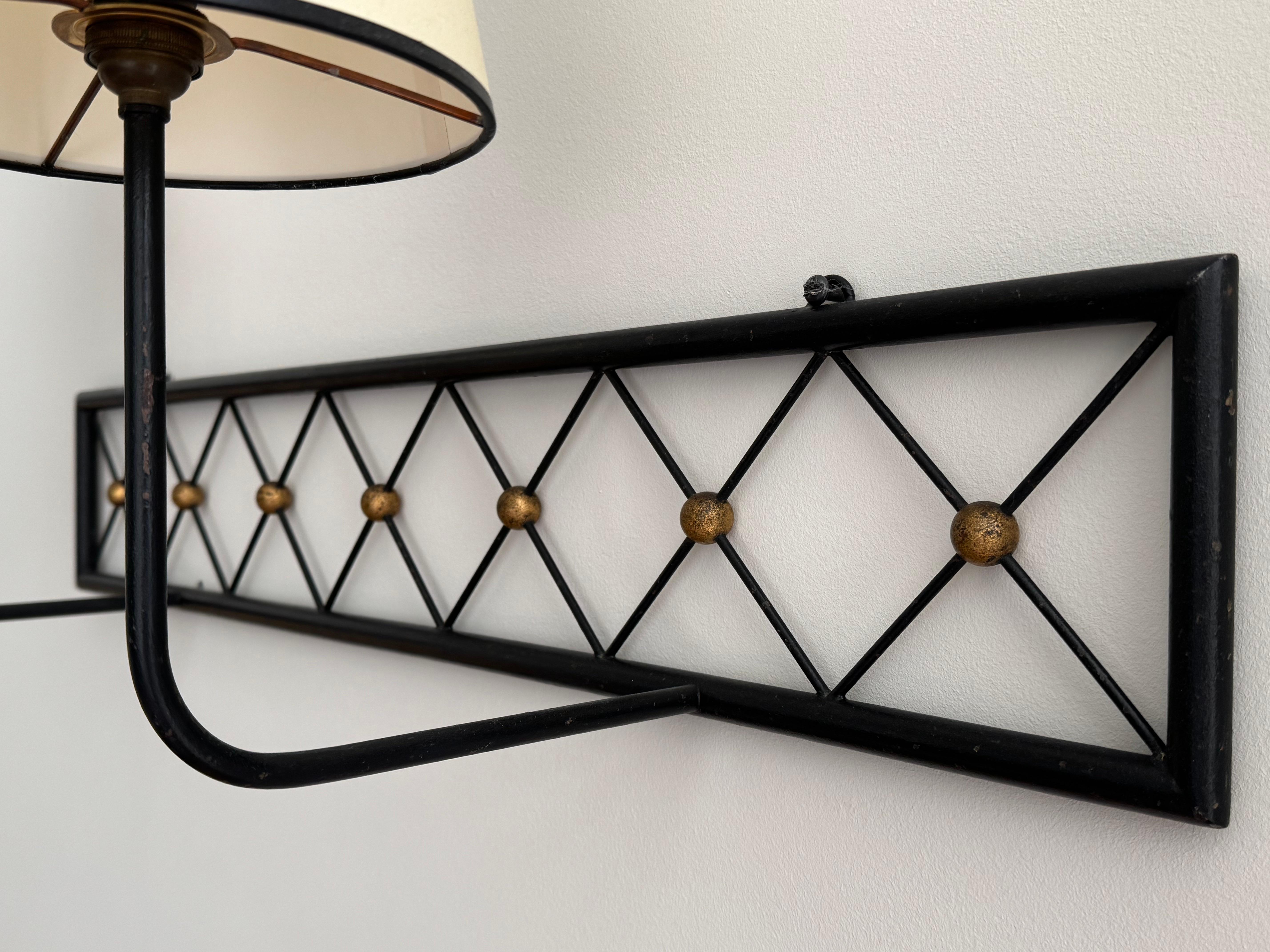 Two-arms Tour Eiffel wall light in black painted and gilt metal In Good Condition For Sale In Soho, London, GB