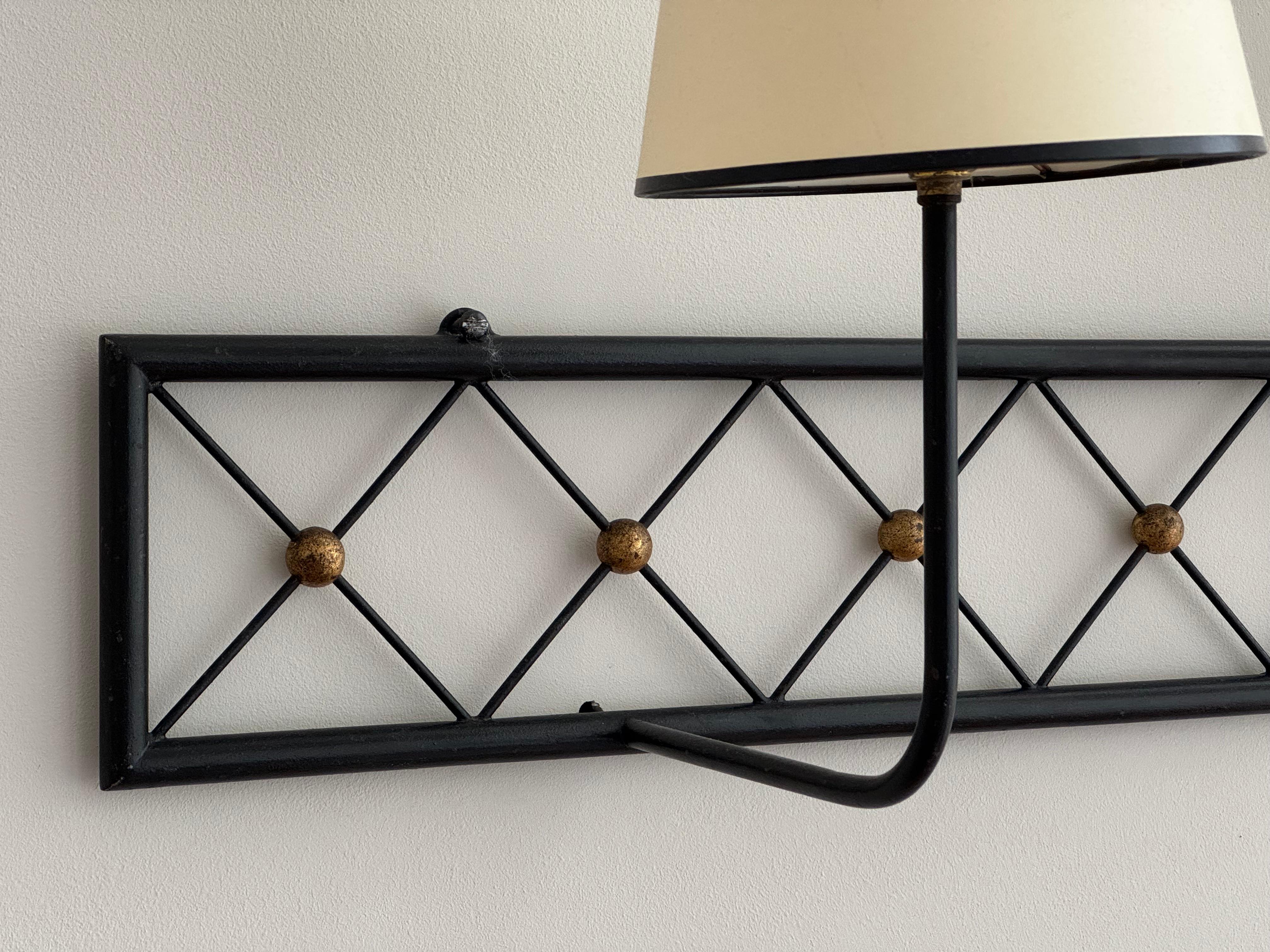20th Century Two-arms Tour Eiffel wall light in black painted and gilt metal For Sale