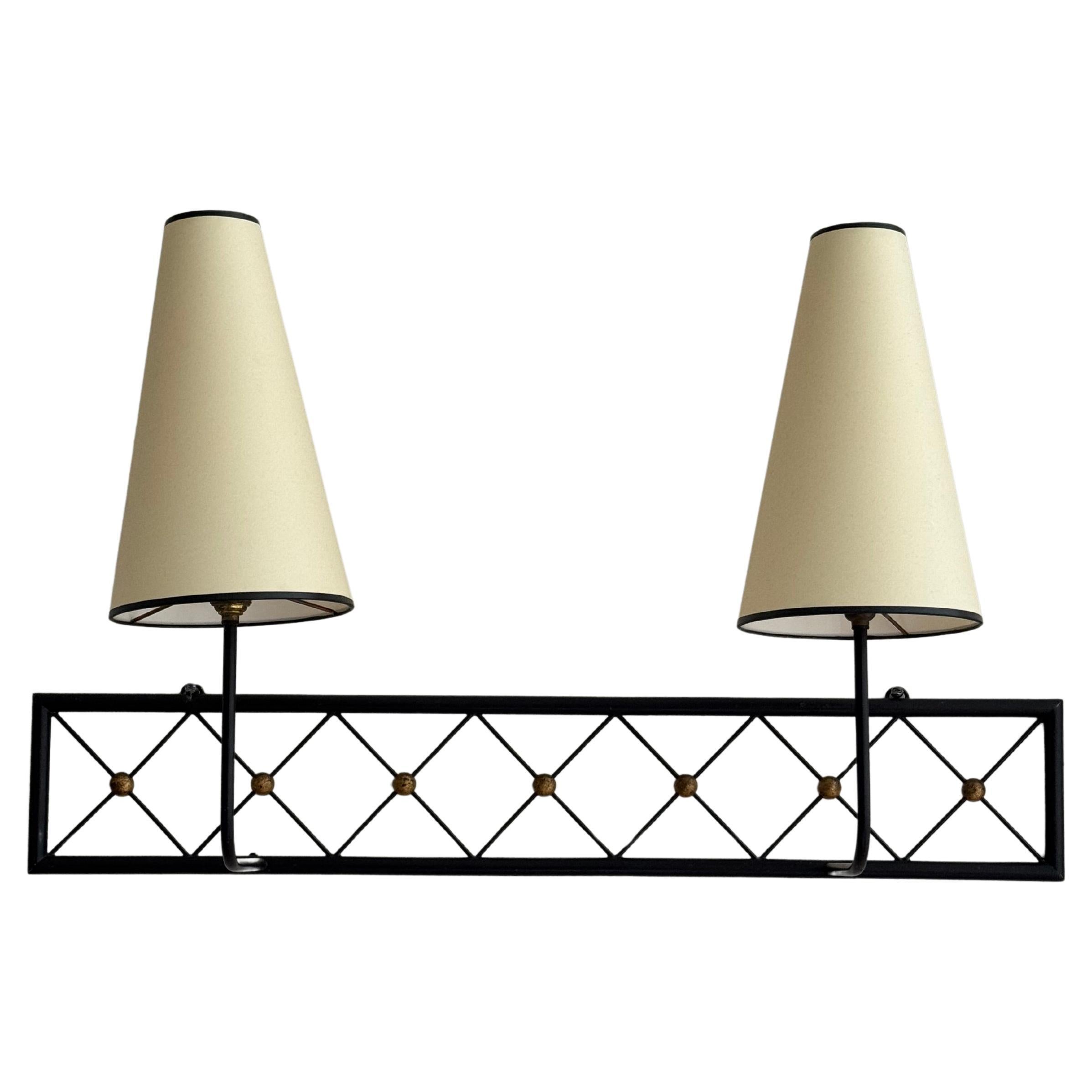 Two-arms Tour Eiffel wall light in black painted and gilt metal For Sale