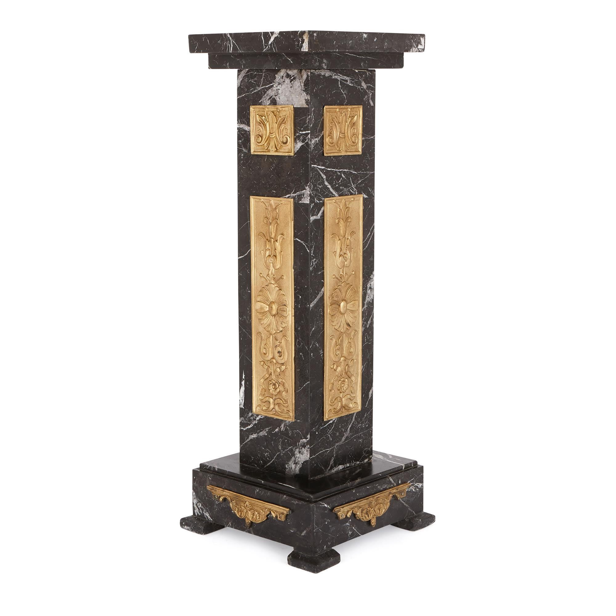 These stylish black marble stands (or pedestals) were designed in France in the 1920s, when the Art Deco style was all the rage. In a reaction against the linear, sinuous character of the Art Nouveau, the Art Deco was largely characterized by