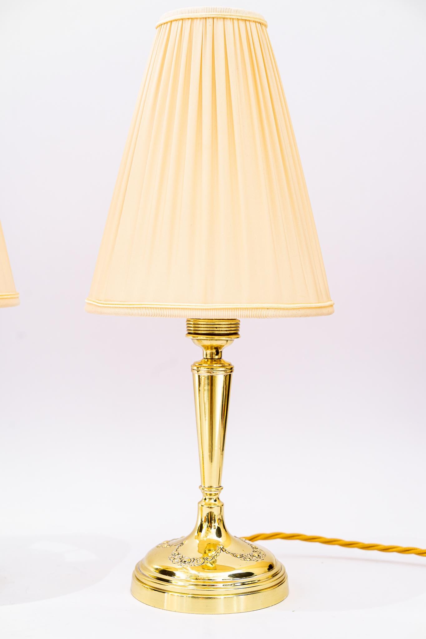 Two Art Deco Table lamp, Vienna, around 1920s
Polished and stove enameled.
The fabric shades are replaced (new).