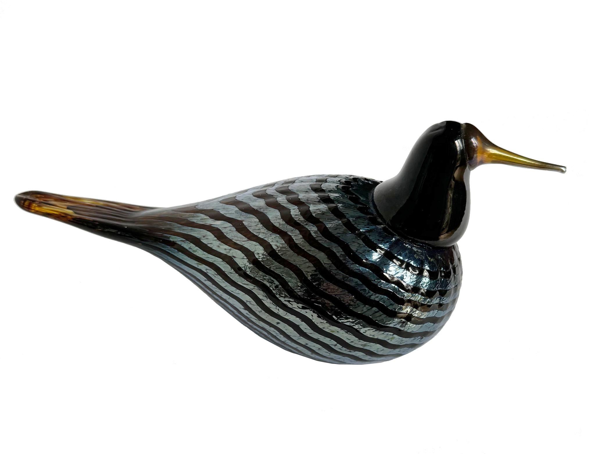 Two Oiva Toikka Art Glass Bird Sculptures, made for Iittala.  Oiva Toikka's birds have become iconic objects for glass collectors worldwide. Each figurine is mouth-blown and handcrafted, giving it its own character and coloring. Both of the birds is